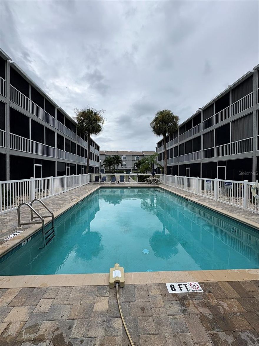 Don't miss this chance to call this home! This 3-story townhome offers updated features throughout with 3 bedroom, 3.5 bathrooms. The third bedroom is on the 1st floor and would make a great bedroom and or office space. It has an open floorplan, a screened in patio/balcony, a one car garage, a boat dock with a 10,000lb boat lift and MORE! The community has a heated, in ground saltwater pool to relax at when you aren't out exploring the bay on your boat. This unit is the definition of Florida living! This unit does come partially furnished with beds in the master and 2nd bedroom, dining table and couches.