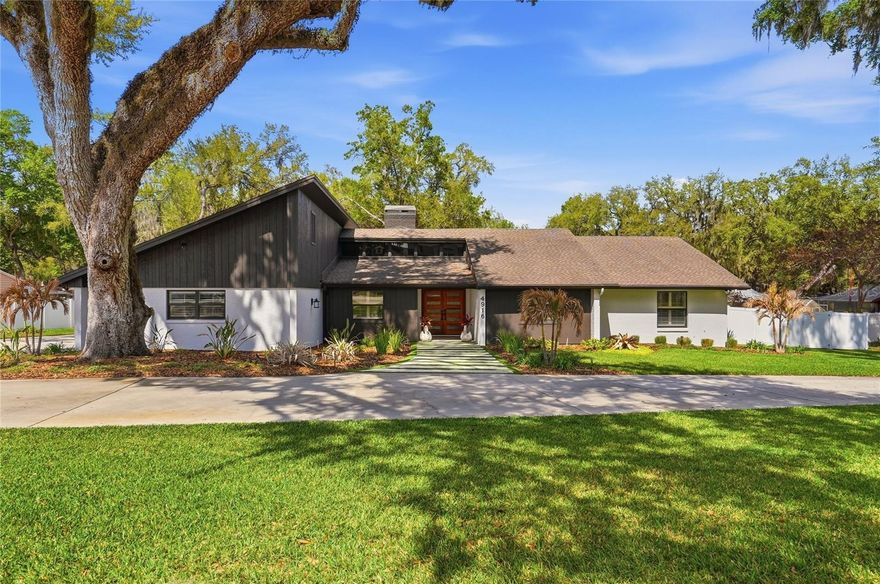 One or more photo(s) has been virtually staged. Bartow… or Lakeland? That might be the first question you ask when you arrive. Perfectly positioned on the outskirts of Bartow in a location that feels incredibly close to Lakeland, this beautifully enhanced five-bedroom, three-and-a-half bath home with a dedicated office offers spacious living, refined finishes, and a backyard designed for unforgettable gatherings. Inside, freshly painted interiors, high-end bedroom carpeting, and custom wood shutters throughout create a warm and inviting atmosphere. The living and dining areas showcase real wood beams, abundant natural light, a beautiful real brick wood-burning fireplace, and a stunning built-in bar, creating a space designed for both everyday living and entertaining. The kitchen features granite countertops, custom cabinetry, under-cabinet lighting, and a whole-house Culligan water filtration system with softeners and reverse osmosis. The primary suite offers a private retreat with granite countertops, a custom glass walk-in shower, and a luxurious standalone soaking tub, while the additional en-suite bathrooms also feature granite countertops. Major updates include two A/C systems with updated ductwork, dual water heaters, roof replacement in 2019, new attic insulation, septic upgrades, and a full security system with cameras. Step outside to a completely transformed outdoor space featuring new irrigation, drainage systems, landscape lighting, a custom heated saltwater pool and spa with full automation and screened enclosure, a perimeter fence, and a custom patio with plumbing for a future outdoor kitchen and bathroom. Conveniently located near parks, shopping, dining, and everyday amenities, 4916 Ironwood Trail offers modern comfort and elevated Florida living in a location that perfectly blends Bartow charm with Lakeland convenience. Some pictures have been virtually staged and certain landscaping photos have been virtually enhanced to show the yard's typical appearance compared to the effects of the recent cold snap.