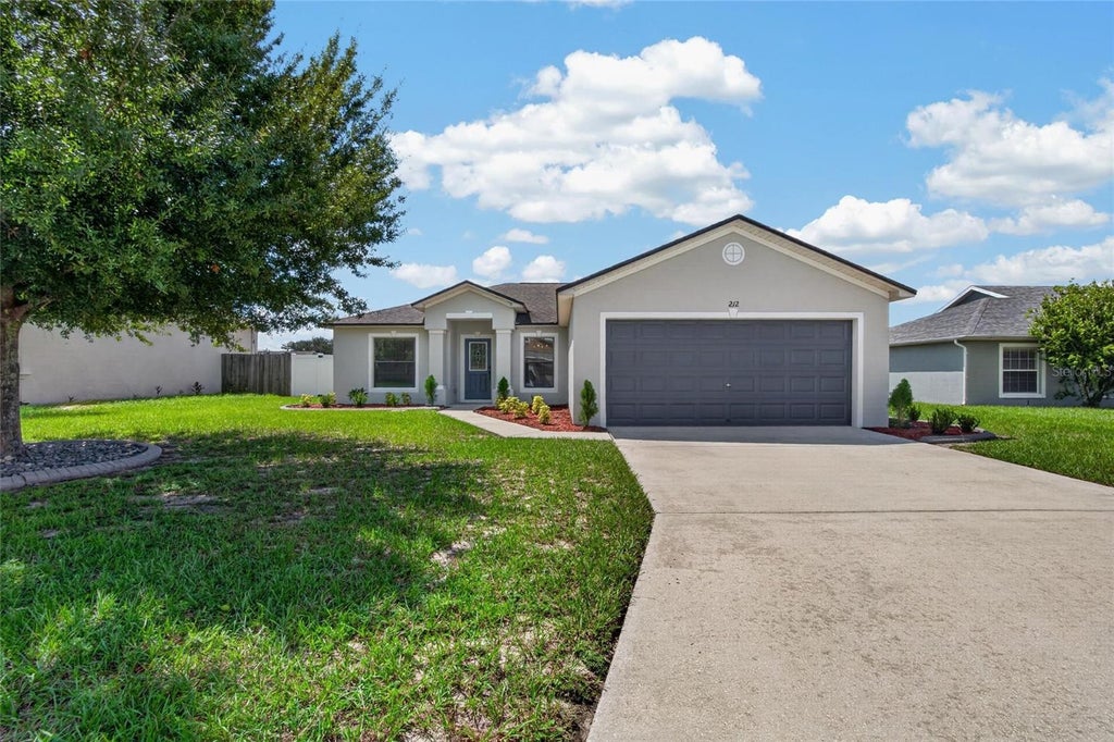 Photo of 212 Majestic Gardens Lane, Winter Haven, FL 33880 (MLS # TB8547254)