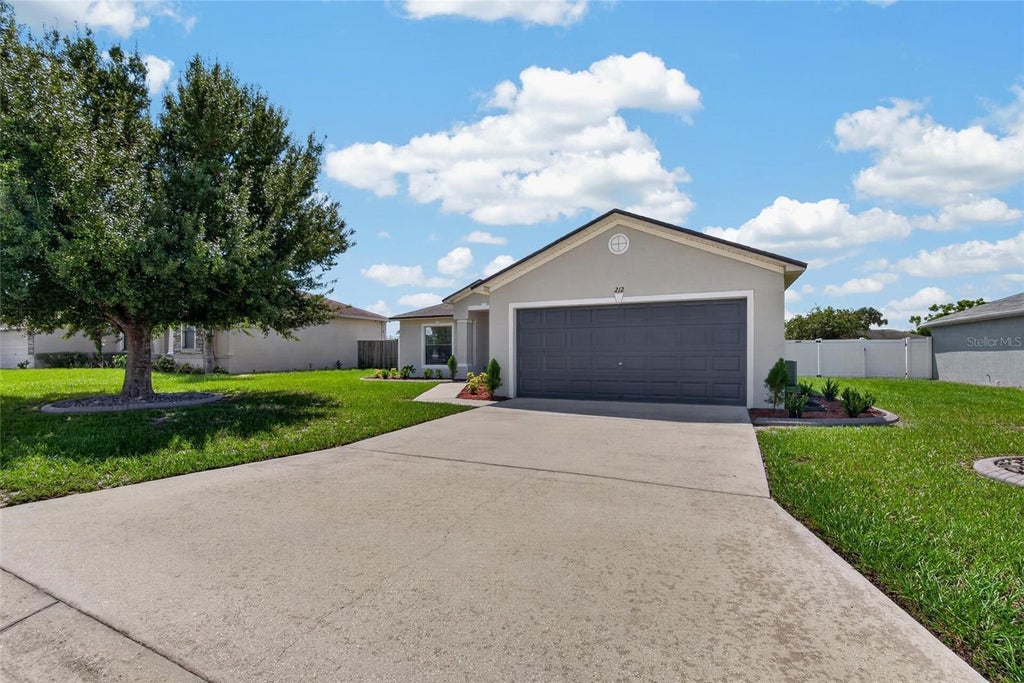 Photo of 212 Majestic Gardens Lane, Winter Haven, FL 33880 (MLS # TB8547254)