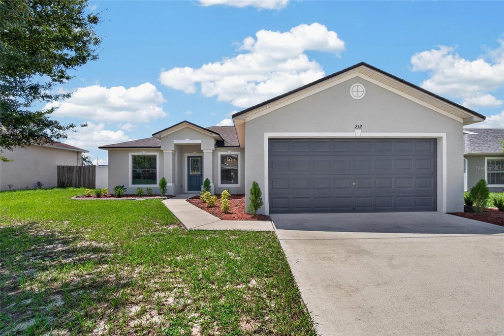 Photo of 212 Majestic Gardens Lane, Winter Haven, FL 33880 (MLS # TB8547254)