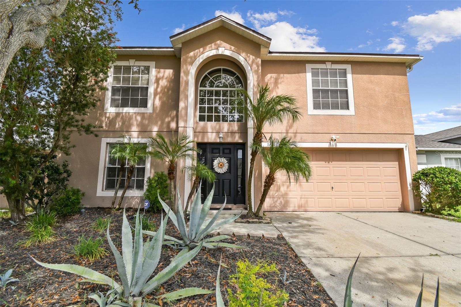 Welcome to this beautiful 4-bedroom, 3.5-bath home offering 3,002 square feet of thoughtfully designed living space in the desirable community of Suncoast Pointe. This well-maintained home features a brand new roof and newer HVAC system, giving you peace of mind and energy efficiency from day one. As an added bonus, the seller is offering a $5,000 flooring credit, giving you the opportunity to customize the home to your style! From the moment you arrive, you’ll appreciate the formal living and dining areas—perfect for entertaining—along with a convenient half bath on the main floor. At the heart of the home is the expansive chef’s kitchen, ideal for cooking and gathering, featuring generous counter space, modern appliances, and ample cabinetry. The adjoining family room is warm and inviting, complete with a custom feature wall and sliding doors that lead to a fully fenced backyard with peaceful conservation views—perfect for cookouts and outdoor fun. Upstairs, a spacious bonus area offers endless flexibility as a home office, gym, media room, or playroom. The luxurious owner’s suite provides a true retreat with dual walk-in closets, a soaking tub, and plenty of space to relax. A second bedroom with its own en suite bath is perfect for guests or teens seeking privacy, while two additional bedrooms and a full bathroom complete the upper level. Located just minutes from the Suncoast Expressway, top-rated schools, shopping, dining, and more, this home offers the perfect balance of convenience and tranquility. Don’t miss your chance to make this stunning home yours—schedule your private tour today!