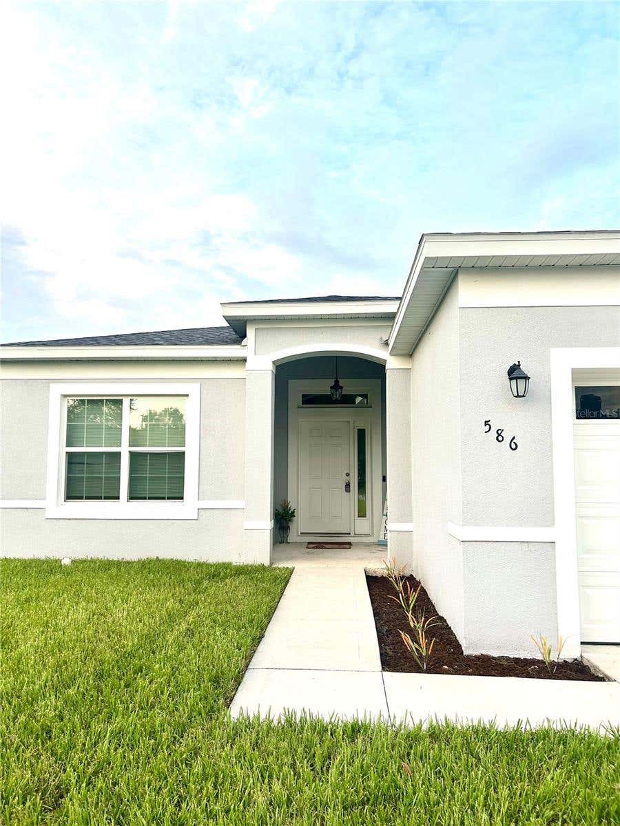 Photo of 586 Geraldine Drive, Deltona, FL 32725 (MLS # O6432514)