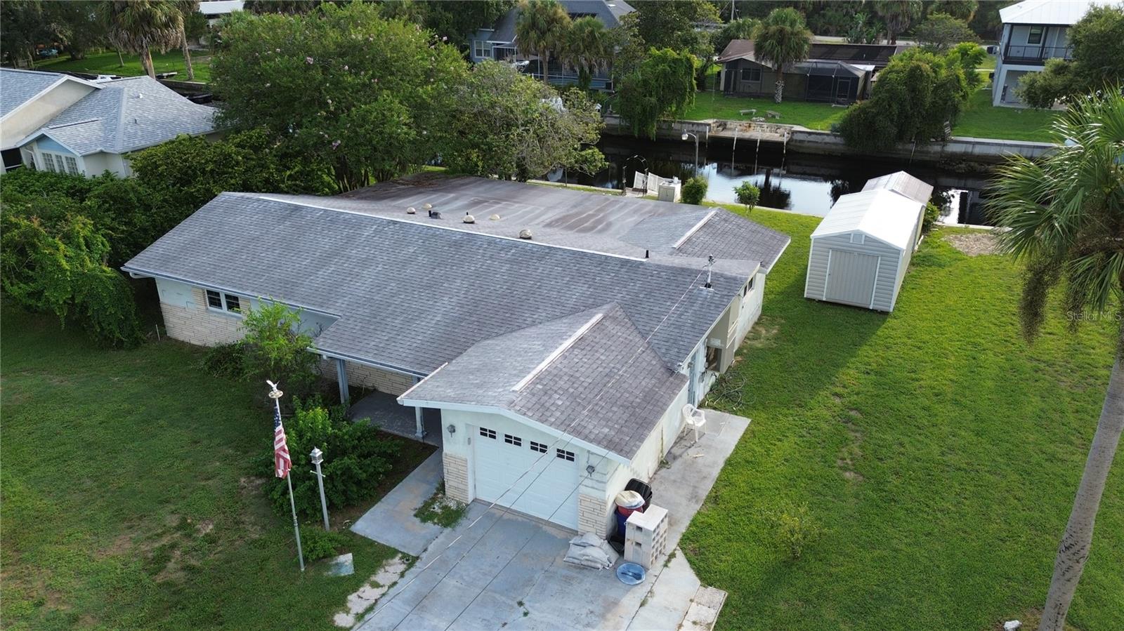 Location, Location, Location! Calling all investors & handymen to restore this beauty. Located on one of the few DEEP water canals leading to the Gulf, & in unincorporated Citrus County, so short-term rentals are allowed. This home features over 2000 sq ft of living space, 3 bedrooms, 2 baths & 2 huge bonus rooms, plus the back porch is also closed in with an A/C unit. This home flooded during last year's storms. However, the kitchen is still in good condition, featuring custom-built real Hickory soft-close cabinets, two pantries, pull-out drawers in all cabinets, Corian countertops, a convection/microwave oven & cook-top. Tarazzo floors throughout the home. The water view is spectacular! composite dock & an 85' seawall. There is an RV hookup on the side of the home, Roof replaced in 2017, A/C 2021, tankless hot water heater, double-hung windows, 5 solar tubes for natural light, new plumbing to kitchen & bathrooms, Water filtration system, & a beautiful backyard with fruit-bearing loquat trees. Enjoy world-famous fishing, from snook to redfish and cobia to snapper, there are endless varieties of fish in Crystal River for you to catch! Also, Scalloping, local festivals, award-winning seafood restaurants, shopping, and Fort Island Gulf Beach. Schedule your appointment today!