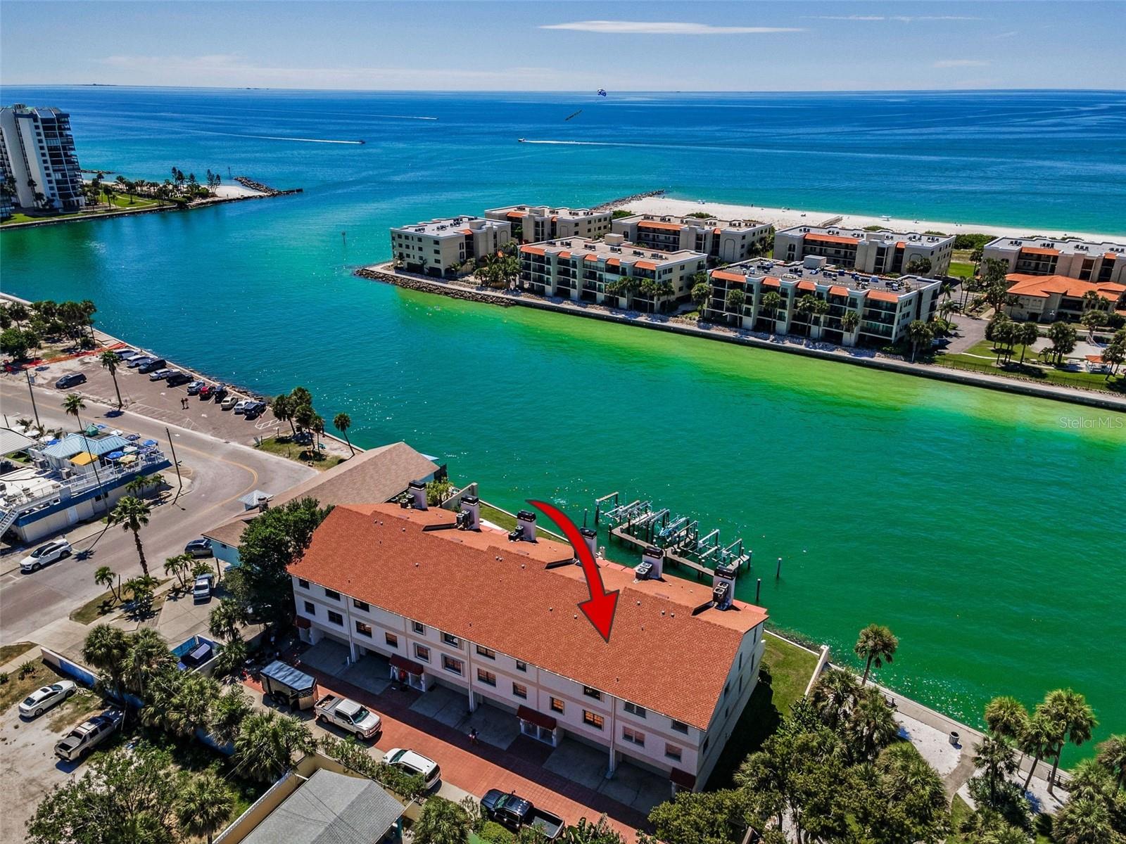 Coastal Waterfront LUXURY at its finest! This RARE townhome-style condo offers sweeping views of Blind Pass Channel, designer interior that has been remodeled to perfection, a private boat lift with mere seconds to the Gulf and a FOUR CAR TANDEM GARAGE!
One of just six exclusive residences, this home offers the convenience of condo living paired with the privacy and feel of a townhome. Step inside and be captivated by the completely reimagined interior and where every detail has been thoughtfully designed. Gorgeous European White Oak engineered hardwood flooring throughout the home. The stunning chef’s kitchen is a showpiece, featuring custom cabinetry, Quartz countertops, a heart-stopping island is as functional as it is beautiful with it's sleek waterfall ends creating a seamless modern look, while the oversized design provides ample workspace for meal prep or gathering around. A designer tile backsplash, and premium Café Series appliances, including double ovens, induction cooktop, under counter microwave, and beverage refrigerator. Two full pantry systems provide endless storage, while the breakfast bar flows seamlessly into the living room. Here, a modern water-vapor fireplace and expansive double sliders open to a covered deck with composite decking, framing panoramic water views. An elegant dining area, spacious guest bedroom/office, and stylish half bath complete this level.
Upstairs, the primary suite is a true sanctuary. Wake to unobstructed water views revealed at the touch of a button with motorized blinds, or enjoy morning coffee on the private covered tiled balcony. The retreat includes dual custom walk-in closets and a spa-inspired bath with double vanities, designer tile, built-in storage, and an oversized glass shower. A second guest suite with private bath and walk-in closet ensures visitors are pampered, while a large utility room adds convenience.
The entry level boasts a four-car tandem garage with abundant storage and direct access to your private 7,500 lb. boat lift. With water and electric at the dock, boating and fishing become effortless.
Every inch of this residence reflects a meticulous renovation by the current owners. Upgrades include recessed lighting on dimmers, solid wood doors with custom hardware, motorized blinds, a new electrical panel, hot water heater, and garage door. Community amenities elevate the lifestyle further with a sparkling waterfront pool, newer pool equipment, composite decking, and porch awnings.
For those seeking the elegance of a luxury waterfront home without the density of a high-rise, this property offers an unmatched lifestyle of privacy, sophistication, and coastal convenience. This residence must be seen in person to be fully appreciated.