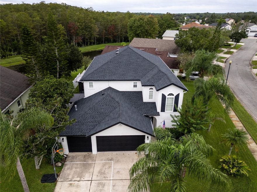 *Welcome to Eastwood’s Most Stunning Pool Home: Modern, Upgraded and Turn-Key* Situated in the Highly Sought-After 32828 Zip Code, boasting A-Schools. *5-Bdrms, 2.5-Baths, 3-Car Garage* Featuring tall ceilings, at first entry this beautiful home greets you with a New Modern Full-Height Impact-Resistant Front Door, leading you into a wide open floor plan. *LUXURY VINYL PLANK FLOORING throughout.* The Kitchen is a DREAM— equipped with DESIGNER UPGRADES, including QUARTZ COUNTERTOPS AND BACKSPLASH, BLACK STAINLESS STEEL APPLIANCES, a DEDICATED ICE MAKER, POT FILLER, 42-INCH SHAKER CABINETS, COFFEE STATION, BUILT-IN FLOOR-TO-CEILING PANTRY CABINETS, AND MORE! Downstairs also features your Indoor Laundry Room with Custom Built Organization! The Primary Bedroom is downstairs, featuring a brand-new CUSTOMIZED WALK-IN CLOSET. The en-suite bath is fully updated featuring a Soaker Tub, Modern Glass Shower, QUARTZ WALL ACCENT, and Brand-New Vanity with Under-Cabinet Power. Upstairs boasts a LARGE BONUS SPACE perfect for a second living room, Movie Room, Game Space, Play Area or whatever your heart should desire! There are 4 secondary bedrooms upstairs, with a Full Updated Bath. Enjoy the OUTDOOR OASIS with a LARGE FULLY SCREENED-IN POOL and JETTED SPA, COVERED LANIA and brand-new Concrete Pavers. The Backyard is FULLY-FENCED with a Corner View of the Pond, and also features professional Turf. *ROOF replaced (2022), Tankless Water Heater (2021), 5-Ton AC (2021), Exterior Paint (2022), PLANTATION SHUTTERS throughout, Heat Pump for Spa & Pool (2021), Full App & Wifi Automation for Pool and Spa, EV Charging in Garage, Whole House Generator Connection, Lightning Rod and Ground System on Roof, New Double Pane Impact Resistant Windows Throughout!* DON’T MISS THIS COMPLETELY MOVE-IN READY LUXURY HOME!