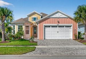 Welcome to your coastal-inspired retreat in Latitude Margaritaville! This elegant Breeze model blends modern comfort with coastal charm, offering 2 bedrooms, 2.5 bathrooms, a 2-car garage, and a versatile flex room that easily converts into a third bedroom. Designed for effortless living and entertaining, this home captures beautiful water views from the moment you arrive. A widened walkway and glass front door lead you into a bright, open living space where natural light pours through expansive sliding glass doors. Throughout the home, you'll find 8-foot interior doors, neutral tile flooring, plantation shutters, and crown molding, all adding to the elevated coastal feel. The gourmet kitchen is the centerpiece of the home, showcasing quartz countertops, a gas range, stainless steel appliances, a new backsplash installed in 2025, soft-close cabinetry, and 42'' upper cabinets topped with crown molding. The adjacent dining area features a stylish light fixture and opens seamlessly into the spacious living room with a tray ceiling, perfect for relaxed gatherings or entertaining friends.
The primary suite offers a private retreat with two walk-in closets with wood shelving and a spa-style bathroom featuring dual vanities, white cabinetry, quartz countertops, and a frameless glass walk-in shower with floor-to-ceiling tile. The guest suite provides comfort and privacy with its own en suite bath, quartz countertop, a pocket door, and wood shelving in the closet. The laundry room combines function and style with a newer washer and dryer and Serena & Lily wallpaper that infuses the space with personality. Adjacent to the garage entry, a quartz-topped stop-and-drop area with cabinetry keeps daily essentials neatly within reach. Open the sliding glass doors to your extended lanai with pavers, the perfect spot to enjoy morning coffee or evening cocktails while taking in the tranquil water views visible from every rear window. Community & Lifestyle: Designed for vibrant 55+ living, this community blends recreation, relaxation, and connection. Enjoy resort-style pools, state-of-the-art fitness center, restaurant, theater, live entertainment daily, pickleball and tennis courts, dog park, art studio, and a private beach club with shuttle service. HOA maintenance includes lawn care, exterior pest control, and access to all community amenities, so you can truly live the Margaritaville lifestyle. Roof 2021 | HVAC 2021 | Tankless Hot Water Heater 2021
Square footage received from tax rolls. All information recorded in the MLS intended to be accurate but cannot be guaranteed.