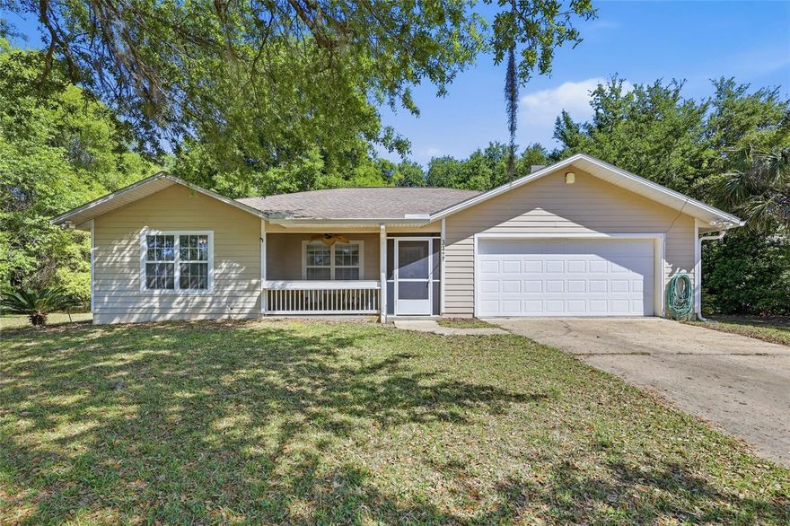 Calling all fishing and boating enthusiasts! Welcome Home to the Four Lakes Community in Hawthorne, with this 3 bedroom/2 bathroom home just 5 minutes from the public boat ramp. The open floorplan encompasses the great room featuring vaulted ceiling, dining area and kitchen providing seamless transitions from one to the other. Kitchen features plenty of cabinetry for all your culinary needs with window overlooking the screened lanai and raised breakfast bar area for additional seating. Primary bedroom has a double wall closet and large window overlooking the spacious backyard. Ensuite primary bath large vanity and tub/shower combo. Secondary bedrooms with wall closets and second full bathroom with single vanity and tub/shower combo. French doors from the great room lead to the large (over 500 sf) enclosed screened lanai with paver flooring and built-in cabinets with sink makes for the perfect entertaining area. Tile flooring throughout, no carpet! Laundry room provides additional storage including folding area, attached 2 car garage, fully fenced, on paved road and sitting on .48 acres.  NO HOA! Multiple lakes within minutes from property ready for fishing or boating. Enjoy lower Putnam County taxes, property on Clay Electric.