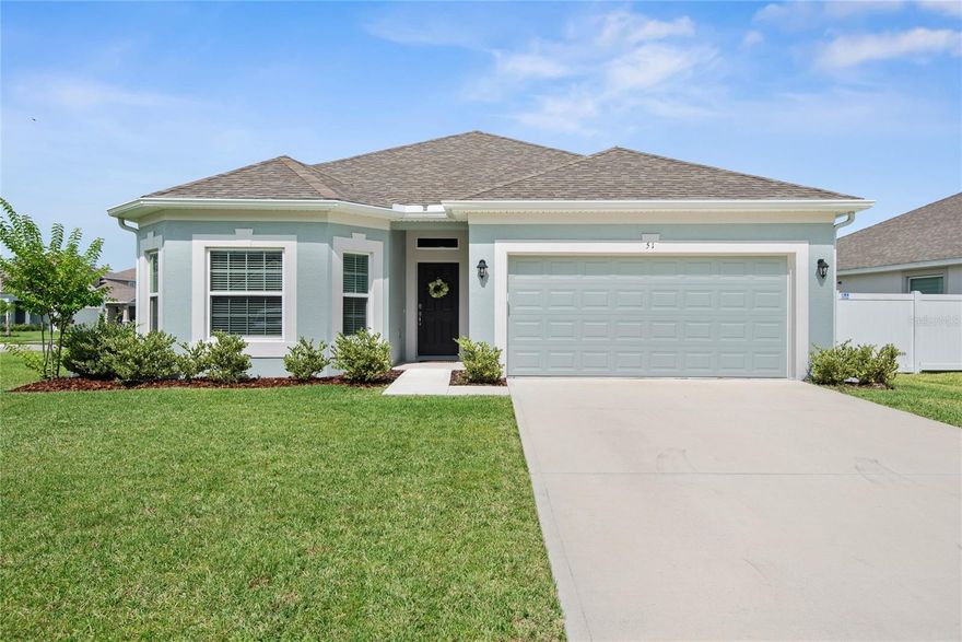 Welcome to Sawmill Creek at Palm Coast Park. This well maintained 2023 Albany II model sits on an oversized corner lot and offers 3 bedrooms, 2 bathrooms, plus a versatile bonus room ideal for a home office or optional 4th bedroom. The open concept layout features high ceilings and an upgraded kitchen with quartz countertops, extended cabinetry, a large island with storage, and a built in desk with USB outlets. Sliding glass doors lead to a screened lanai, perfect for relaxing or entertaining. Additional highlights include EV charging in the garage, keyless entry, concrete block construction, and energy efficient features. Community amenities include a pool and nearby walking, jogging, and biking trails. Conveniently located near US 1 with easy access to I 95, beaches, shopping, dining, and historic St Augustine. Move in ready and a must see.