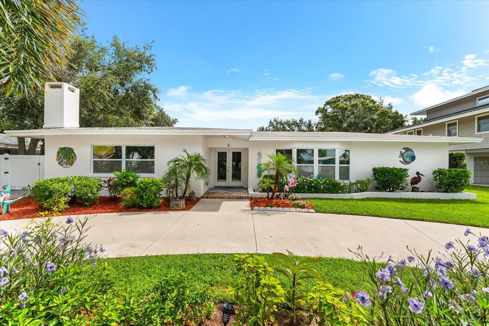 Welcome to 125 Carlyle Drive on Indian Bluff Island in the heart of Palm Harbor—a rare opportunity to enjoy island living with the conveniences of the mainland just minutes away. Nestled on a spacious 0.33-acre lot with partial views of St. Joseph’s Sound, this beautifully maintained four-bedroom, two-bath pool home blends comfort, function, and location.
The single-story layout offers 2,279 square feet of living space with a split floor plan, open-concept design, and thoughtful updates throughout. The kitchen and family room flow seamlessly into the living and dining areas, creating an inviting space for gatherings and everyday living. The primary suite features a walk-in closet and tranquil views of the water and surrounding landscape.
Interior highlights include vinyl plank flooring, crown molding, solid-surface countertops, and energy-efficient appliances including a built-in oven, cooktop, refrigerator, microwave, dishwasher, and washer and dryer. The home is equipped with central air and electric heating, enhanced with HVAC UV and electronic filtration for improved indoor air quality.
Step outside to your saltwater pool with child safety fencing, in-ground lighting, and a covered rear patio. The fenced yard has been thoughtfully landscaped with Florida-friendly, non-toxic materials. Additional features include hurricane shutters and windows, a sprinkler system, a circular drive, covered parking, and ample guest parking.
This property is zoned for some of the most sought-after schools in Pinellas County, including Sutherland Elementary, Palm Harbor Middle, and Palm Harbor University High School. The Pinellas Trail runs right by the island, offering biking access to Honeymoon Island State Park, Wall Springs Park, and other local attractions. While Indian Bluff Island provides a quiet, private setting with no through traffic, everyday shopping, dining, and entertainment are just a mile away.
Community details include an optional HOA at $150 per year, includes trash pick-up.
This home offers the ultimate Gulf Coast lifestyle with sunset views, nearby water access, and the convenience of Palm Harbor living. It is truly a must-see.