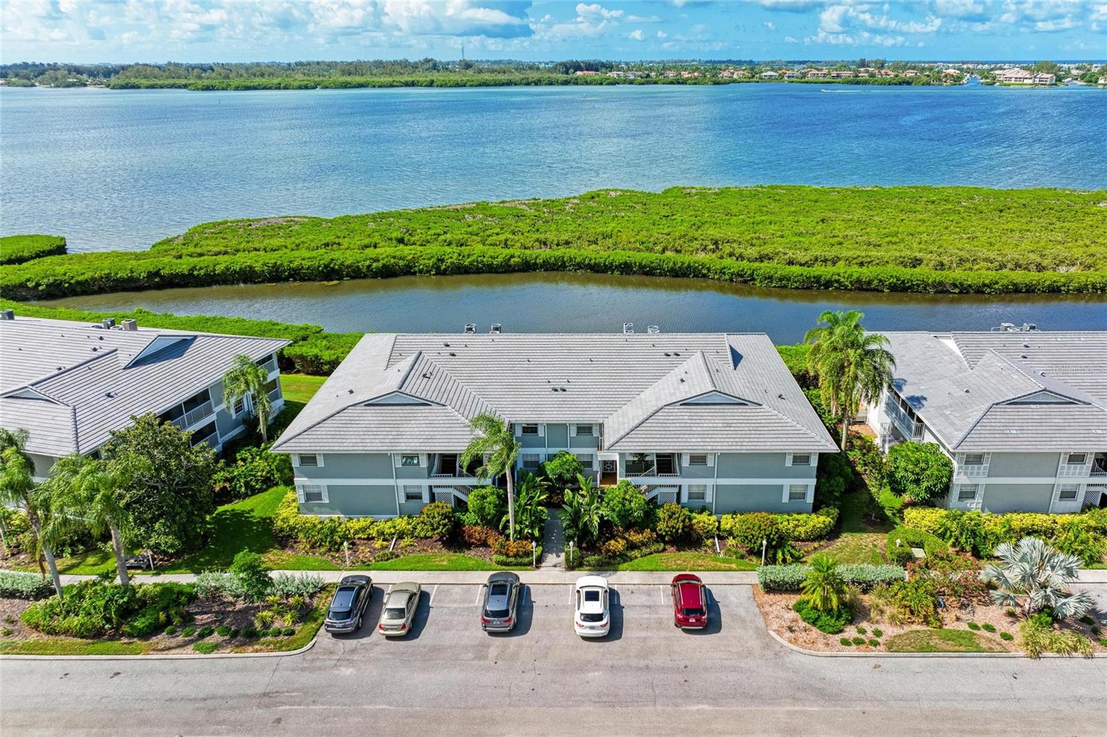 Discover your coastal sanctuary in this beautifully designed second-floor Turnkey condo with soaring high ceilings and breathtaking views of Palma Sola Bay and the Intracoastal waters. From the spacious Florida room’s floor-to-ceiling windows, enjoy sweeping water vistas that change with the tides and capture Florida’s spectacular sunsets.
This spacious 3-bedroom, 2-bath home offers an inviting kitchen with a breakfast bar, and a second screened, covered lanai perfect for relaxing with morning coffee. The open-concept living room flows seamlessly into a formal dining area, ideal for entertaining.
This condo has added hurricane protection by automated hurricane shutters throughout the lanai areas.
Located in the highly sought-after Perico Bay Club, a gated Community. You’ll enjoy world-class amenities, including Community pool, clubhouse, and tennis courts, Shuffleboard and kayak launch with bay access
Edgewater III has private pool directly across the street from the condo for ultimate convenience.
This condo also comes with a one-stall garage and additional garage storage, the Florida Room also offers a large storage area.
Just minutes from the Gulf beaches, Anna Maria Island, shopping, and dining, this is the perfect blend of relaxation and convenience.
Don’t miss your chance to own a piece of Florida’s waterfront paradise! All measurements are approximate, buyer to verify all HOA and room sizes.