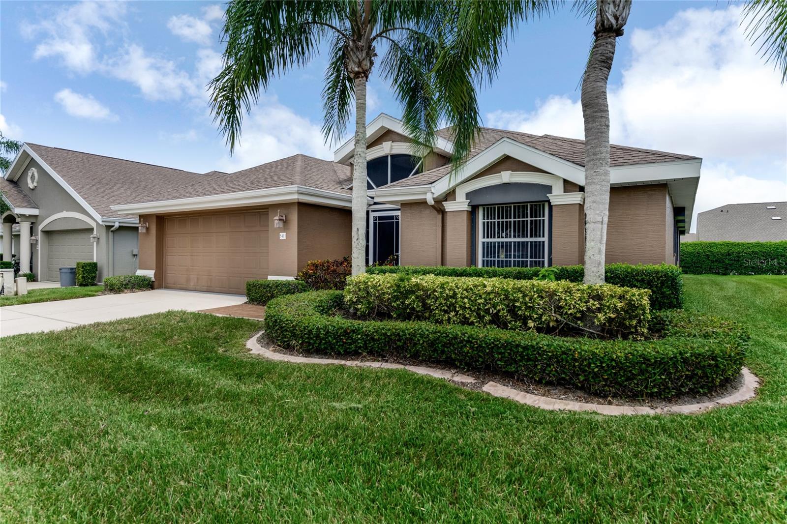 $20,000 CREDIT TO BUYER FOR A NEW ROOF OR UPDATES! Here's a great chance to own a well-kept 2006-built Churchill Plan on a quiet, low-traffic horseshoe-shaped street on Canna Ct. The home sits near the front of the community, so you're just a short walk from the clubhouse and all the fantastic amenities. Inside, this comfortable home features 3 bedrooms, 2 bathrooms, and a large kitchen with plenty of cabinet and counter space—perfect for cooking and entertaining. The main living areas showcase rich laminate flooring with a warm wood tone, while the bedrooms, bathrooms, and kitchen feature tile flooring—all easy to clean and maintain. The kitchen and baths have classic white raised-panel cabinets that give the place a fresh Florida vibe.
Both the air conditioning system and water heater were replaced in 2021, so those big-ticket items are taken care of. You'll also appreciate the hurricane shutters for added peace of mind during storm season. The screened front porch and rear lanai with sliding vinyl windows are great spots to relax and catch some fresh air. Outside, the queen palms and landscaping really make the home stand out. Plus, it has a nice large backyard lush with green grass, perfect for relaxing, gardening, or play. Garage also has screen panels that can be put on or taken off.
This home is priced below market, making it a smart buy if you want quiet, convenient living in Port Orange. You're close to I-95, I-4, State Road 44, and Tomoka Farms Road, so getting around town or heading out of town is easy.
You're also near everything you needhospitals, urgent care, churches, and top-rated schoolsplus a brand-new ALDI just opened around the corner. The beach is only about a 15-minute drive to the world's most famous beach, perfect for weekend trips or evening walks. Orlando is about an hour away, with Disney World just a few minutes further south, and Orlando International Airport roughly an hour's drive, depending on your route.
The Villages of Royal Palm feels like a real community with 24/7 gated security and a clubhouse that offers a ballroom, fitness center, library, billiards, and craft rooms. Stay active or social with two pools, a whirlpool spa, tennis and pickleball courts, shuffleboard, bocce ball, a putting green, basketball courts, horseshoes, and more. The HOA helps with the outdoor worktaking care of lawn care, exterior pest control, sprinkler system maintenance, cable and internet, pressure washing, and exterior painting every six years. It's not completely maintenance-free, but it takes a lot off your plate and keeps the neighborhood looking sharp.
If you're looking for a relaxed Florida lifestyle in a friendly community that feels like home, this is it. Call today before it's gone!