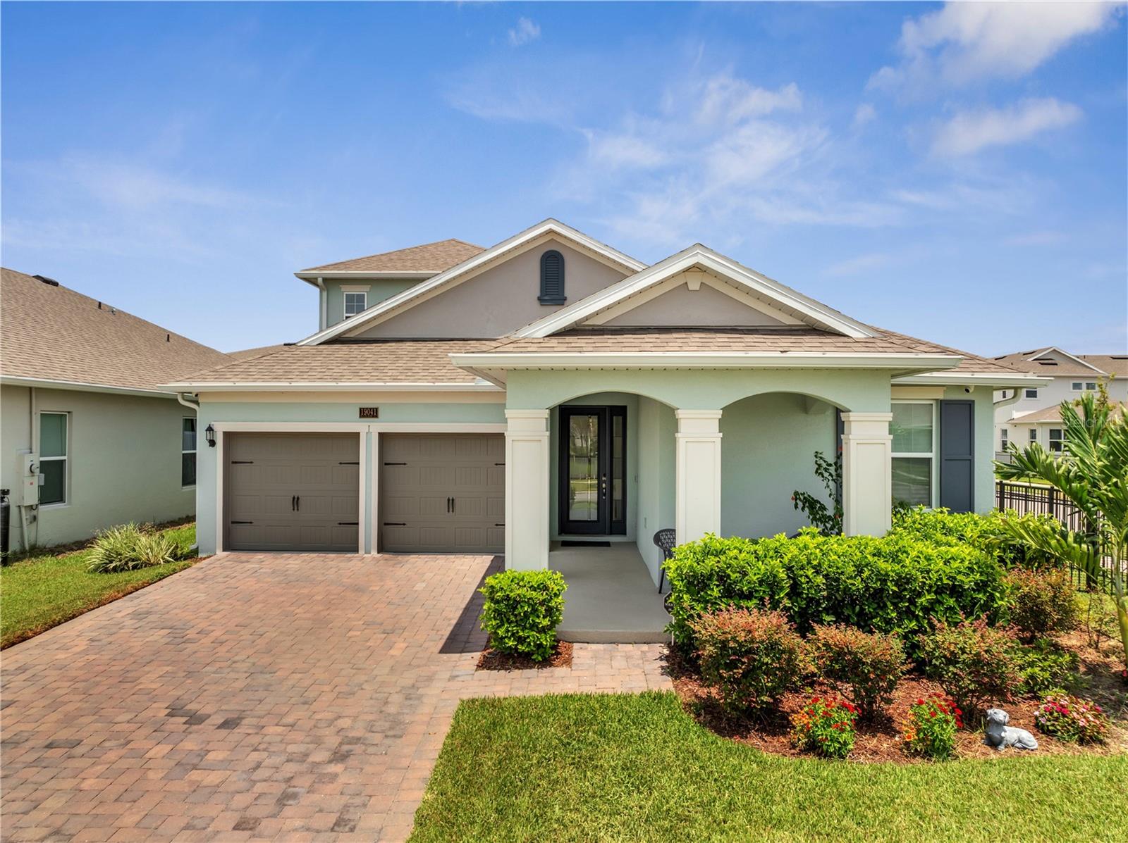 One or more photo(s) has been virtually staged. One or more photo(s) has been virtually staged. Priced to sell! Stunning, model-like 4 bed/4 full bath Anna Maria WITH BONUS loft, on a NEWLY FULLY FENCED CORNER PREMIUM LOT in one of the newest subdivisions of Lake Nona, Summerdale Park. This immaculate home features over $125,000 worth of structural and design upgrades, including a FRONT PORCH with serene views of the park, pond and incredible sunsets, SECURITY SYSTEM with CAMERAS, Pre-Wired for EV CHARGING STATION, PRE-PLUMBED for OUTDOOR KITCHEN and INCLUDED WATER SOFTENER SYSTEM, GUTTERS and NEW FRENCH DRAIN. The GOURMET KITCHEN is a chef's dream, complete with oversized ISLAND with built in CERAMIC FARMHOUSE SINK, bar seating, SAMSUNG BESPOKE REFRIGERATOR with CUSTOMIZABLE PANELS, STAINLESS STEEL APPLIANCES, HOOD which vents to the outside, ceramic glass stovetop, separate microwave and oven cabinet, designed for entertaining, facing the dining space and OPEN CONCEPT great room. The family room fully opens for indoor/outdoor living with full POCKET DOORS leading to the COVERED LANAI, and is pre-wired for surround sound speakers. High-end WOOD LOOK TILE covers the floors throughout the home, and plush carpet covers the bedrooms. The primary bedroom retreat features TWO WALK-IN CLOSETS, a dual vanity en-suite bathroom, with an extended OVERSIZED WALK-IN SHOWER with double and RAINFALL SHOWERHEADS. The 3 additional spacious bedrooms and bathrooms are in a 3 way SPLIT FLOORPLAN configuration on the first floor for added privacy, and the large 2nd story loft which includes a full bath and walk in closet, which can be easily converted to a 5th bedroom, provides a flexible space to create, work, or entertain. This opulent residence is rounded out by an indoor laundry room with INCLUDED WASHER AND DRYER and sink pre-plumb, and a 2 car garage, with EPOXY floors and an extra long paver driveway. The community HOA includes HIGH SPEED FIBER OPTIC INTERNET, neighborhood pool, playground, green spaces and Kayak launch pad. Adjacent to Laureate Park, the community is also zoned for Lake Nona's A-rated schools, and close to the airport, major highways, the VA hospital, diverse Michelin star dining, shopping, golf, entertainment, 35 min from theme parks and 50 from the beaches, and the best of the evolving area of Lake Nona!