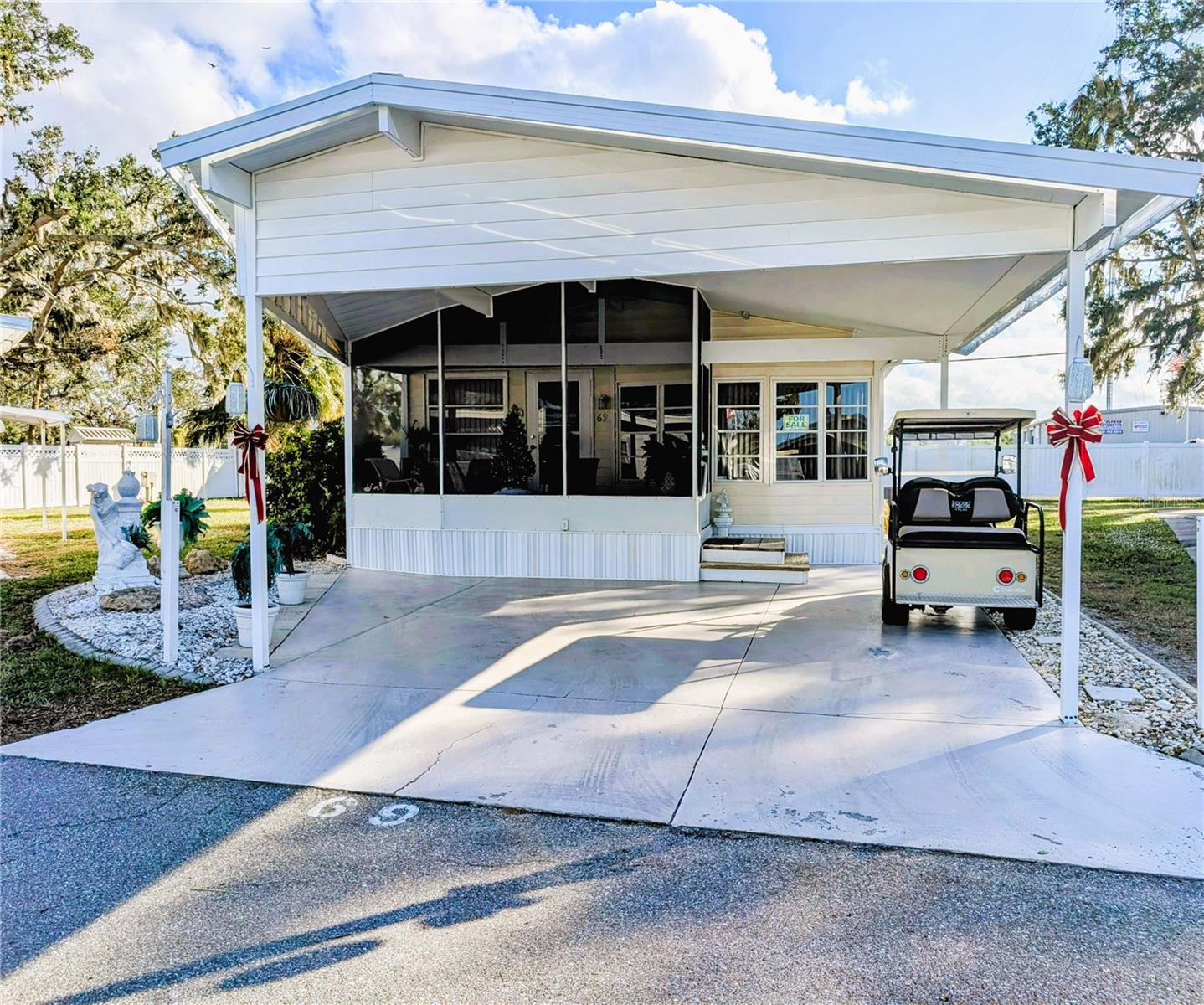Welcome to this beautiful mobile home! This home features a beautifully decorated home. All furnishings and appliances are included. This home has been well taken care of and well loved. Large carport and private seating area in back are some of the highlights. This is a pet lot, so bring your furry friend with you! This community requires a minimum credit score of 750 to purchase.