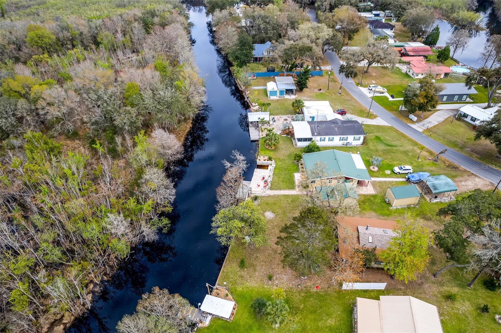 Waterfront Paradise on Withlapopka Island – Right in the Heart of Floral City! Whether you’re looking for a vacation rental, weekend escape, or a freshwater fishing retreat, this charming canal-front home delivers. Situated on a navigable canal with direct access west to the Inverness Chain of Lakes or east to the Withlacoochee River, the location is ideal for boating, fishing, and waterfront relaxation. Enjoy a scenic cruise and dock at the famous Sleepy Hollow Fishing Camp for live music, great food, and cold drinks! This 2-bedroom, 1-bath home features vaulted ceilings and a massive 400 sq ft covered porch overlooking the lake—perfect for soaking in the peaceful views. Extensively updated in 2024–2025, recent improvements include: Cement board siding and exterior paint (Feb 2024) Vinyl plank flooring (Feb 2024) New electric panel (Feb 2024) New septic tank and leach field (May 2025) Electric tankless water heater (Feb 2024) Full interior repipe (Feb 2024) Roof (July 2022) Three new mini-split HVAC units (Feb 2024) Renovated bathroom with new tub, toilet, vanity, and tile (Feb 2024) This turnkey home is move-in ready and bursting with potential—schedule your showing today!