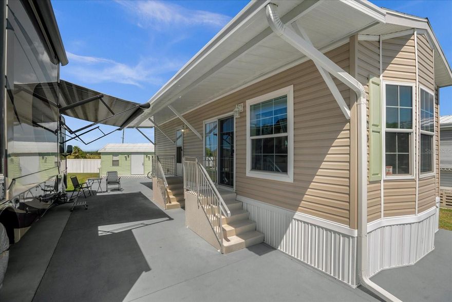 GATED COMMUNITY - BEST VALUE IN MOUNT OLIVE SHORES - SKYLINE MANUFACTURED HOME - FULLY FURNISHED - NEW AWNING - HIGH-END FINISHES - CROWN MOLDING THROUGHOUT - LUXURY VINYL PLANK FLOORS - STAINLESS STEEL APPLIANCES - WHOLE HOUSE REVERSE OSMOSIS WATER TREATMENT SYSYTEM - NATURAL LIGHT - BUILT-IN CABINETRY - ADDITIONAL PARKING - NEW WATER HEATER - WASHER AND DRYER - Welcome to the epitome of luxury living in the GATED COMMUNITY of Mount Olive Shores! It is the BEST VALUE IN MOUNT OLIVE SHORES. Step into this meticulously maintained SKYLINE MANUFACTURED HOME, boasting unparalleled elegance and comfort. Built in 2021, this home comes FULLY FURNISHED and is a testament to modern sophistication. As you approach, you'll be greeted by a NEW AWNING that adds both charm and functionality to the exterior. Step inside to discover HIGH-END FINISHES at every turn, from the CROWN MOLDING THROUGHOUT to the LUXURY VINYL PLANK FLOORS that exude opulence throughout. The kitchen is a chef's dream, featuring STAINLESS STEEL APPLIANCES, 42" cabinets wrapped in crown molding, and a WHOLE HOUSE REVERSE OSMOSIS WATER TREATMENT SYSTEM ensuring the purest water for your culinary endeavors. NATURAL LIGHT floods the living space through glass sliders and bay windows, creating a bright and inviting atmosphere. The living room boasts a tray ceiling with crown molding and is equipped with a ceiling fan for added comfort. Both the living room and primary bedroom showcase decorative BUILT-IN CABINETRY, adding a touch of sophistication and ample storage space. Speaking of the primary bedroom, it also features a ceiling fan for optimal comfort. Outdoor enthusiasts will appreciate the ADDITIONAL PARKING space for an RV, complete with all public utility hookups. Plus, a large 20x10 shed with 50 amp service provides ample storage and convenience, featuring a new water heater and full-sized WASHER AND DRYER. Located in the highly desired Class A motorhome community of Mount Olive Shores, this property offers the perfect blend of tranquility and convenience. Situated near I-4, residents enjoy easy access to Orlando, Tampa Bay, and all major attractions. Don't miss out on the opportunity to make this exquisite property your new home sweet home. Schedule your viewing today and experience luxury living at its finest!