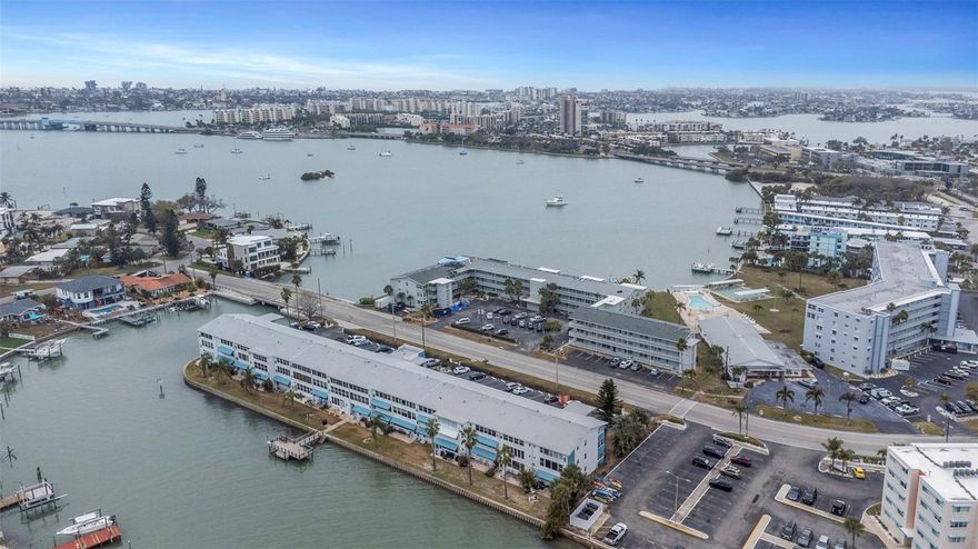 One or more photo(s) has been virtually staged. Recently professionally remediated and updated sparing no expense, this residence is essentially brand new from the drywall in and features all-new appliances, including a 5-burner gas range. Enjoy relaxed waterfront living at Shore Plaza, a beautifully maintained 55+ community set along Boca Ciega Bay in South Pasadena. This 2-bedroom, 2-bath condo with a bright Florida sunroom offers sweeping panoramic water views and effortless Florida comfort—perfect for year-round living or a seasonal escape.Start your day with tranquil bay views and gentle coastal breezes, then unwind with colorful sunsets from your enclosed Florida room overlooking the Intracoastal Waterway. The open, inviting layout features a spacious living area that flows seamlessly into a well-appointed kitchen with ample cabinetry, new appliances, and stunning waterfront views.The primary suite showcases beautiful bay views, dual closets, and a private ensuite bath, while the guest bedroom offers convenient access to the second bath with updated tilework and fixtures.Key updates include impact windows installed in 2021, enhancing both peace of mind and energy efficiency.Residents of Shore Plaza enjoy a host of resort-style amenities, including a bayside waterfront pool, fishing pier and dock, clubhouse with fitness center and billiards, a catering kitchen and inviting social spaces, as well as waterfront picnic areas equipped with gas grills—perfect for relaxing and entertaining while taking in the coastal setting.The property also includes assigned parking and additional shared storage on the same floor. Monthly maintenance fees cover water, gas, cable/internet, and building maintenance, and the community’s central gas boiler system can help reduce insurance costs.Ideally located just minutes from St. Pete Beach, Treasure Island, and Downtown St. Petersburg, you’ll enjoy easy access to shopping, dining, medical facilities, and the SunRunner. The St. Pete Pier, Dalí Museum, and vibrant waterfront restaurants are all a short drive away.Enjoy exceptional waterfront value with comfort, convenience, and a carefree coastal lifestyle at Shore Plaza—an outstanding opportunity to own and enjoy daily living that feels like a getaway..Shore Plaza maintains a no-pets, no-leasing policy, fostering a quiet, owner-occupied atmosphere.