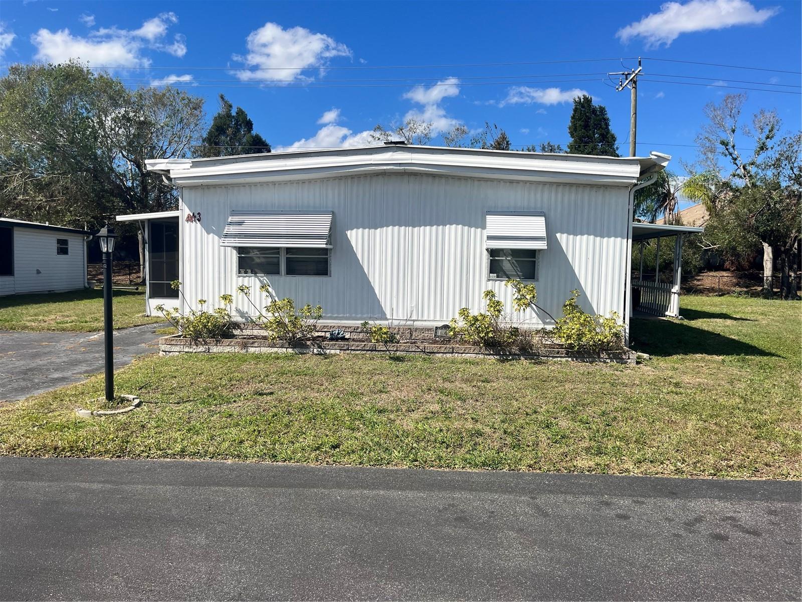 Rare 3 bedroom/2 bath unit with a nice open floor plan. Eating area in kitchen plus a dining area. Large screened in lanai. The owners have replaced much of the floors with plywood but have not redone the flooring. Been vacant for 3-4 years but the a/c and electric has always been on. Some minor damage from the storms . WestWinds Community gives you a peaceful feeling as you tour the neighborhood. Friendly smiles and waves will immediately make you feel at home and EVEN ALLOWS 2 PETS with NO WEIGHT restrictions. Numerous social activities give you a chance to meet your new friends and neighbors. With their fun scheduled activities of dinners, and Community Trips. Lunches, Card games, Shuffleboard, Boccie Ball, Billiards & Cards, Play Horseshoes, Large Heated Community pool & Hot Tub. WestWinds even has RV/Boat Storage space with special pricing for their Residents.