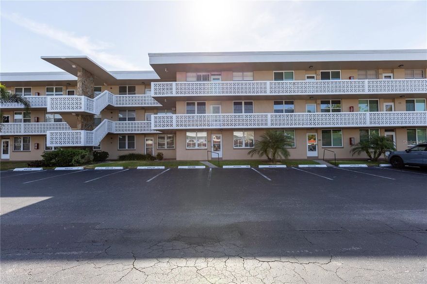 Welcome to Winston Park—where comfort, convenience, and an active lifestyle come together in one beautifully maintained 55+ community. This spacious 2-bedroom, 2-bath second-floor condo offers peaceful garden views and an open, airy layout designed for easy living.

Step inside to find a recently remodeled interior featuring stylish laminate flooring throughout, an inviting open floor plan, and an abundance of natural light. The updated eat-in kitchen overlooks lush greenery, creating the perfect setting for your morning coffee. The primary suite boasts a generous walk-in closet, while thoughtful upgrades like newer double-pane impact windows (installed just five years ago), modern ceiling fans, and updated appliances provide both comfort and peace of mind.

Enjoy the added benefit of a covered carport, private storage, and convenient laundry facilities located on every floor. Elevators in each building ensure easy access.

Relax or stay active—Winston Park offers a vibrant lifestyle with a heated resort-style pool, shuffleboard courts, and a clubhouse full of social events and activities, all set within a tropical, park-like environment.

Ideally located just minutes from downtown St. Petersburg, Tampa, and I-275, you’ll have quick access to shopping, dining, beaches, and two major airports. Everyday essentials like grocery stores, banks, and restaurants are all nearby.

Notably, this residence remained high and dry with no damage during the most recent hurricane, offering an added layer of confidence.