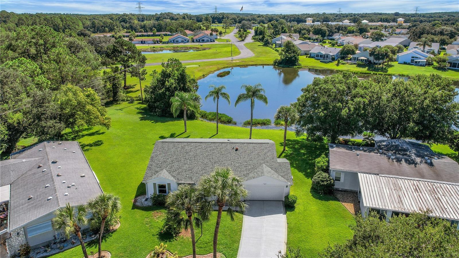 Waterfront 3/2/2 FURNISHED Home! Peace of mind awaits you with the following big ticket items already in place: New Roof (2021), New HVAC Handler (2020), New Hot Water Heater (2016), From the moment you walk up, notice the lovely landscaping and that this home is on a cul-de-sac. Volume ceilings and natural light welcomes you into this open and split floor plan. Enjoy your morning coffee from a variety of areas in this home while watching the sunrise over the water! The large INSIDE laundry room has plenty of cabinetry. This home features practically 2 master suites which is a rare find while the 3rd bedroom does not have a closet, however all three bedrooms have vaulted ceilings giving them an even more spacious feel. All of this and located in The Plantation at Leesburg, a resident owned, gated golf and tennis community featuring 3 activity centers, 3 heated pools and spas, 2 fitness centers, steam rooms, saunas, softball field, tennis, archery, library, restaurant and 100+ activities each week, plus two award winning golf courses. 36 holes of year-round golf available ~ 30-45 minute drive to Orlando attractions ~ an hour drive to either coast. Call or text for a private showing today!