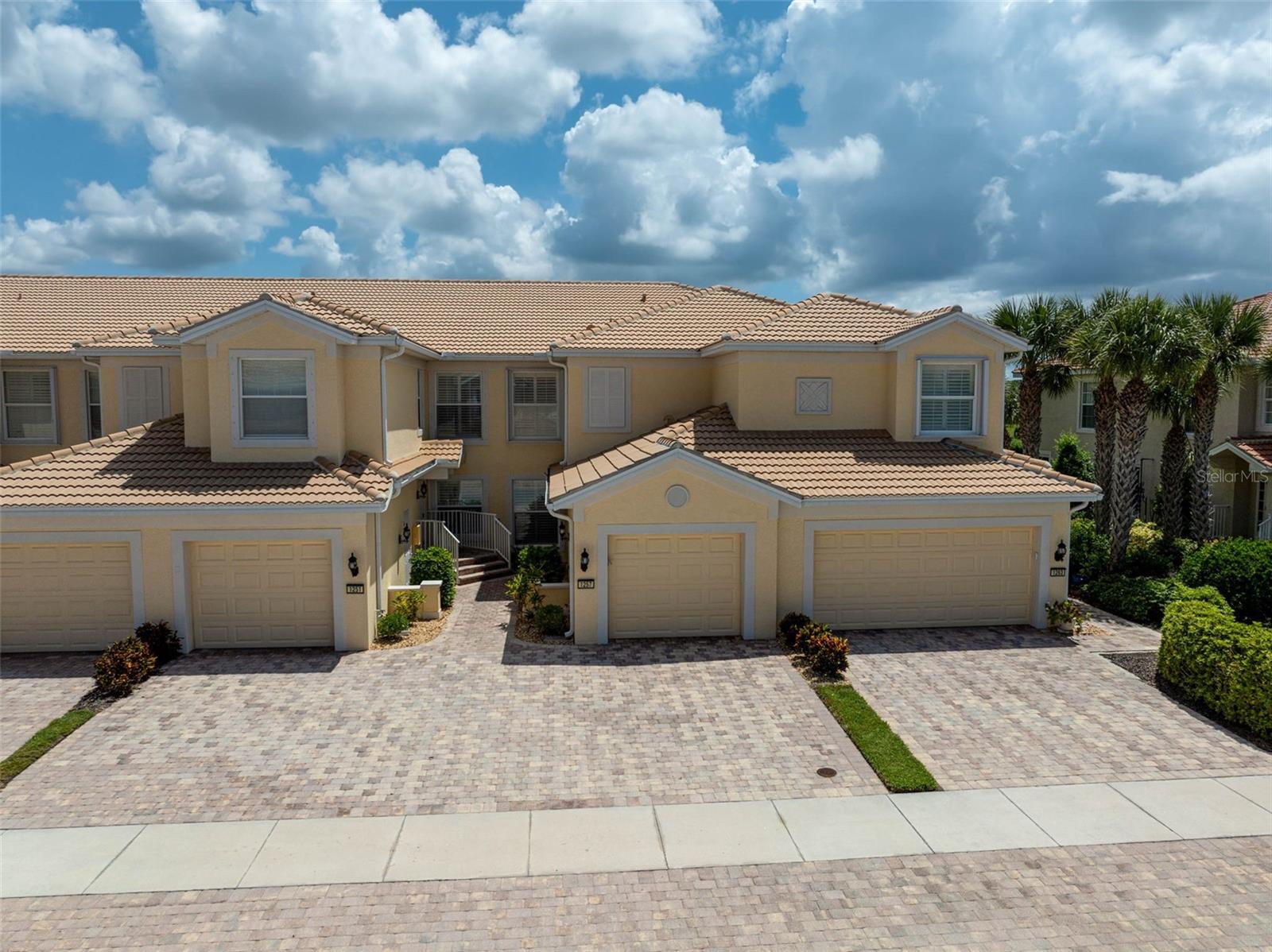 **Highly Sought-After, Maintenance-Free, GROUND FLOOR, CORNER CONDO unit with WATER VIEW** in the popular Lakeside section of THE ISLES on Palmer Ranch. This Meticulously Maintained, Light and Bright, Open Floor Plan boasts 2 BEDROOMS + STUDY/DEN and 2 FULL BATHS plus an ATTACHED 1-CAR CARAGE. Premium Features include Plantation Shutters, Crown Moldings, a nicely-equipped Kitchen with Granite Counters, Solid Wood Cabinets and Stainless-Steel Appliances, etc. The Spacious, Primary Bedroom Suite includes a walk-in closet, primary bath with Dual Vanities, Custom-tiled Shower and Soaking Tub, and offers private sliding door access to the lanai. Enjoy expansive Water and Preserve Views from your Private, Screened Lanai. *NEW* TRANE HVAC (2023), RHEEM HOT WATER HEATER (2024). THE ISLES is an amenity-rich community featuring resort style facilities: Heated Pool, Tennis, Fitness Center, Clubhouse, Playground and Bocce Court. The Isles offers ease of access to I-75, area Beaches including #1-rated Siesta Beach, The Legacy Bike Trail, Shopping, Downtown Sarasota cultural venues, and all that Florida’s Gulf Coast Living has to offer.
