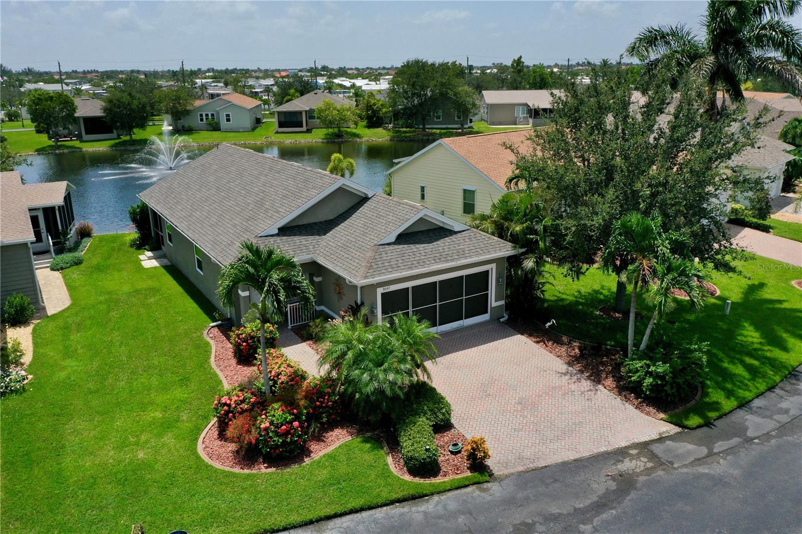 This amazing *FULLY FURNISHED* three bedroom, two bath lake front home in the peaceful gated 55+ community of Rio Villa Lakes is ready for a new owner. Beautifully landscaped, this home is located on a quiet cul-de-sac street where you can take in the views of the large water fountain from your back lanai. The open floor plan leads to a spacious eat-in kitchen with sliders out to a covered and screened lanai. Plenty of counter space and storage with a full pantry. The Inside laundry is in a double closet with easy access in the center of the home. The two guest rooms are nicely sized for this home and share the 2nd bathroom. The master bedroom it has a large window with direct views to the lake and fountain. The spacious master bath has double sinks and a tub shower combination with glass shower doors. Storage is not an issue with this two car garage, You can easily keep your pool and beach toys along with bicycles or outdoor gear in here. The Association maintains the grounds and your membership will include access to the community heated pool, a fitness center, and tennis courts. Get ready for easy living in this paradise community! Don't miss out on this opportunity. Schedule your showing today!