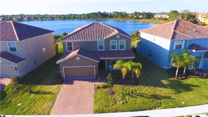Available now! Lakefront 5-bedroom, 3.5-bathroom home with a 3-car garage and private pool, featuring a rare NextGen layout—two separate entrances and living spaces with interior access (essentially two homes in one). The bright, open kitchen with granite countertops and stainless-steel appliances flows into a spacious dining/family room, plus a loft and four secondary bedrooms. Brand-new carpet and fresh interior paint; washer and dryer included, tile roof, and paver driveway. Set within the 24/7 guard-gated Lakeside at Providence community offering resort-style amenities—multiple pools, fitness center, tennis, playground, clubhouse, golf, and on-site dining. Convenient to shopping and restaurants with easy I-4 access for a smooth commute to Orlando, Tampa, schools, parks, and more. HOA approval required—schedule your private showing today!