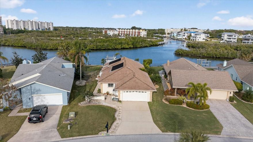 Waterfront living with Gulf access in the heart of Gulf Harbors Woodlands! This 3 bedroom, 2 bathroom waterfront home is perfectly situated on a wide, deep-water canal with direct Gulf access, making it ideal for boaters and water lovers alike. Enjoy Florida living at its finest with a screen-enclosed Pebble Tec pool (solar heated), private boat lift, and a fully fenced yard—perfect for pets and outdoor entertaining.

Inside, you’ll find wood-plank tile flooring throughout, vaulted ceilings, and abundant natural light that creates a bright, open feel. The brand-new kitchen has been opened to the living area, offering a modern layout ideal for hosting and everyday living. Additional features include an indoor washer and dryer and a two-car garage.

Located in the highly desirable Gulf Harbors Woodlands, residents enjoy private beach access for just $200 per year, along with a golf cart-friendly community offering tennis courts, pickleball, a community pool, boat ramp, and the nearby Gulf Harbors Yacht Club, currently accepting new members.

Just minutes from vibrant downtown New Port Richey, an area experiencing exciting growth with restaurants, shops, and waterfront events. Don’t miss this opportunity to own a Gulf-access waterfront home with a pool and boat lift while the market has softened. Schedule your private showing today.