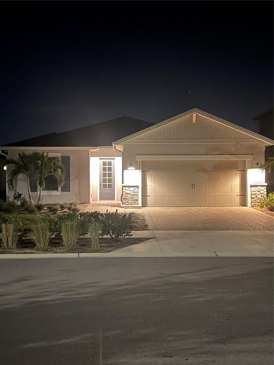 Location! Location! Location! Live a vacation lifestyle every day at your new home in the heart of Babcock Ranch, America's pioneering solar-powered town, where innovation meets sustainability.
This impeccably maintained 2 years new, custom-built single story home boasts over 2,000 square feet of living space, with 4 spacious bedrooms, one of which can be used as a den/office/flex room with double 8-lite glass doors plus 2 full bathrooms. This home includes an oversized two car garage with an extra 4’ of space, full epoxy coated floor and keyless garage entry. This home also includes quartz countertops in the kitchen and bathrooms, tray ceiling in living area with zero corner slider doors opening to the lanai, making the dream indoor/outdoor lifestyle become a reality. The seamless picture screened lanai patio, with freshly sealed pavers, encloses a low-maintenance saltwater inground pool overlooking a private lake and beyond that, direct views of Lake Babcock and Founder’s Square. Lanai also has an extra privacy wall and is fully equipped for an outdoor kitchen. The generous primary bedroom is a true retreat, complete with oversized walk-in closet and an ensuite bathroom featuring a large walk-in shower and oversized soaking tub. Second and third bedrooms are equally spacious and versatile, with adjacent full bathroom, perfect for kids, guests or in-law suite. Both bathrooms have been upgraded to rectangle sinks and all black hardware and faucets. Numerous upgrades throughout this home include a dual whole house water filtration system, extra-large 24” carenza polished porcelain tile throughout the entire home (with 0.5% or less water absorption) with grout recently sealed, all exterior windows and doors are high impact glass, all interior doors include upgraded black hardware, black minimalist remote controlled ceiling fans in every room, including two larger fans in the outside lanai, upgraded laundry room with full upper and lower cabinets, countertop and built-in utility sink.
As a resident of Babcock Ranch, you’ll have access to two resort-style pools with clubhouses, open nature walking trails, dog parks, community gardens, basketball, tennis and pickleball courts and many shopping and dining options. In addition, you have access to weekly events such as Food Truck Fridays and live music, Farmer’s Market Sundays and many many more events daily! Experience the lifestyle you’ve always dreamed of, where sustainability, leisure, and convenience come together so you can live your best life!