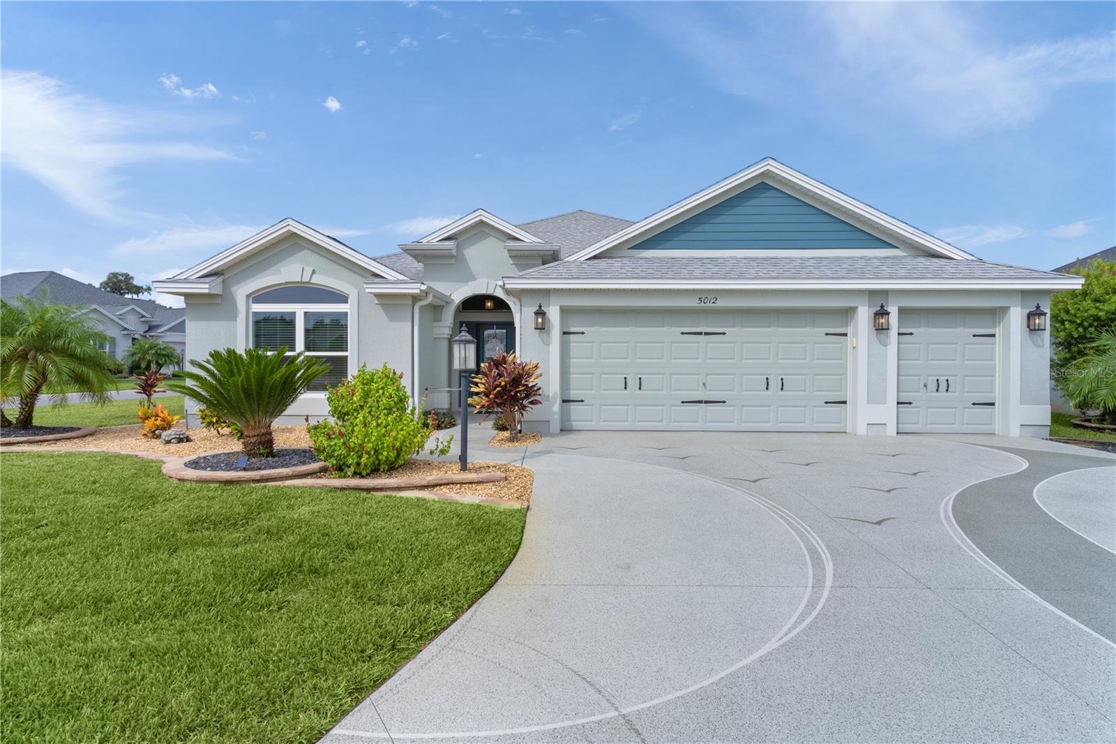 Welcome to this stunning Mossy Oak Floorplan nestled in The Village of Chitty Chatty, featuring 3 bedrooms, 3 bathrooms, 2 car garage plus Golf Cart Garage and Enclosed Screened HEATED SALTWATER SPORTS POOL 15 x 33. Enjoy seamless INDOOR-OUTDOOR living with stacking sliding doors that open to a spacious outdoor area, the Heated Saltwater Sports Pool is designed for Water Volleyball, and casual lounging with the Sun Shelf with Umbrella, and chairs. Premium CORNER LOT adorned with meticulous landscaping lined with stacked pavers, painted driveways, and swaying palms, this residence exudes quintessential Florida charm. The interior boasts Luxury TILE WOOD-LOOK Flooring, Elegant CROWN MOLDING throughout the house, Custom CORNICE WINDOW Treatment, Shiplap CUSTOM FEATURE Wall. The Kitchen is a chef's delight, SAMSUNG STAINLESS STEEL Appliances, and a breakfast bar top has beautiful QUARTZ Countertops, extended height cabinets, and a pantry closet with pull out drawers, Subway Tile backsplash, and pull-out shelves add practicality. This home has the Perfect 3-way split plan and mother-in-law suite. The Primary bedroom features a Tray Ceiling, and a large ensuite bathroom with a ROMAN SHOWER and Custom Built Walk In Closet. The MOTHER-IN-LAW suite has an en-suite bathroom with shower, custom built walk-in closet and is located on a separate side of the house, allowing for private access through the garage and access to the laundry with allowing a pocket door to close off the rest of the house. The guest bedroom has a custom built closet and is also located on the separate side of the house allowing a pocket door to close off the guest bathroom for added privacy. Interior Laundry Room with sink with quartz counter and cabinets. Two-car Garage with EPOXY FLOORS, Storage Cabinets with Quartz Countertop, plus Golf Cart Garage. Attic Pull Down Stairs with Carpeted Decking for Storage. Golf Cart Available. Furniture Available. The ROOF, HVAC & Hot Water Heater are all 2020. The Chitty Chatty Pool is just down the street, and you are conveniently located near Route 44, shopping, dining, and via the CHITTY CHATTY BRIDGE, minutes from LAKE DEATON PLAZA and ROHAN REGIONAL RECREATION CENTER and BROWNWOOD TOWN SQUARE! This home truly embodies luxury living in a prime location. Don't miss out on this great opportunity!!