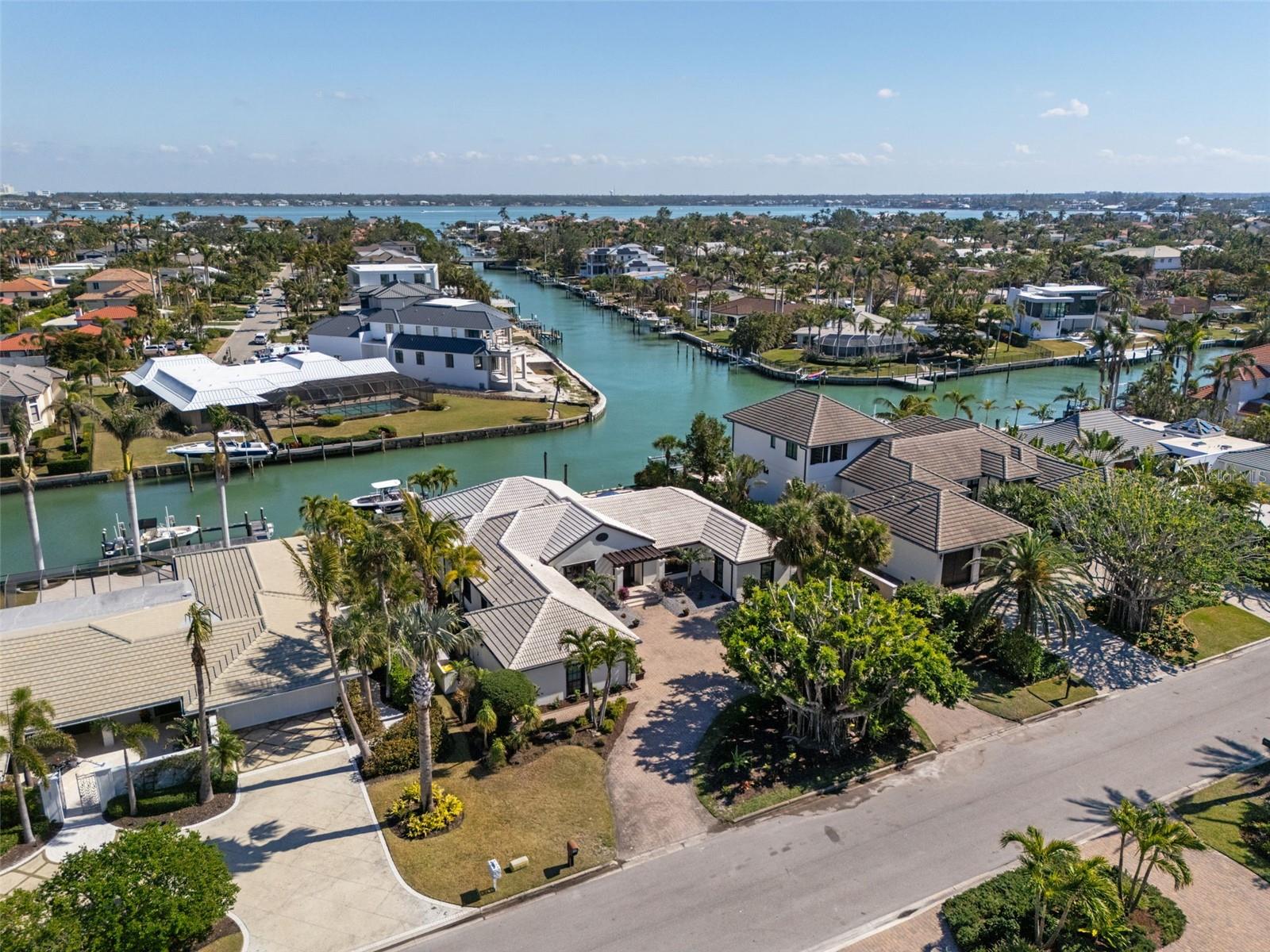 Situated in the highly coveted Bird Key neighborhood, The Banyan House is a stunning expression of refined coastal living. Originally renovated in 2012 by Yoder Homes and thoughtfully reimagined in 2024 by Nova Construction, this home embodies timeless elegance and modern craftsmanship. Every detail has been meticulously cared for, creating a residence that feels as much like a gallery of design as it does a place to call home.
The Banyan House has proven its resilience, sustaining zero storm damage or flooding—a testament to its superior design and construction.
The interior spaces are bathed in natural light, with an intelligently designed floor plan that flows seamlessly, making it ideal for both everyday living and hosting gatherings. Engineered hardwood floors anchor the home with warmth and durability, while the custom kitchen stands as a centerpiece of both form and function, offering premium finishes and top-tier appliances.
With four bedrooms and three full bathrooms, the home balances spaciousness with intimacy. A highlight is the serene sunroom, framed by vaulted ceilings adorned with custom wood accents, a space that invites you to relax while overlooking the lush surroundings.
Step outside to a truly breathtaking outdoor sanctuary. The expansive entertaining area features a fully equipped summer kitchen, a covered dining space with remote-controlled hurricane shades, and a large pool and spa. With 100 feet of private waterfront along a deep-water canal, this home is a boater’s dream, complete with a new boat lift and effortless access to Sarasota Bay.
Further elevating its appeal, The Banyan House offers peace of mind with impact-rated windows and doors throughout. Every element of this home reflects an intentional design philosophy that enhances its natural beauty and premier waterfront setting.
The Banyan House presents a rare opportunity to own a residence where modern luxury, thoughtful design, and the serene lifestyle of Bird Key converge. Whether as a primary residence or a seasonal retreat, this home is truly one-of-a-kind. Extensive feature sheet available upon request.
Be sure to watch this video!!! https://motion-media-llc.aryeo.com/videos/0194f8c0-4d2e-73b7-8dca-099d577faee7