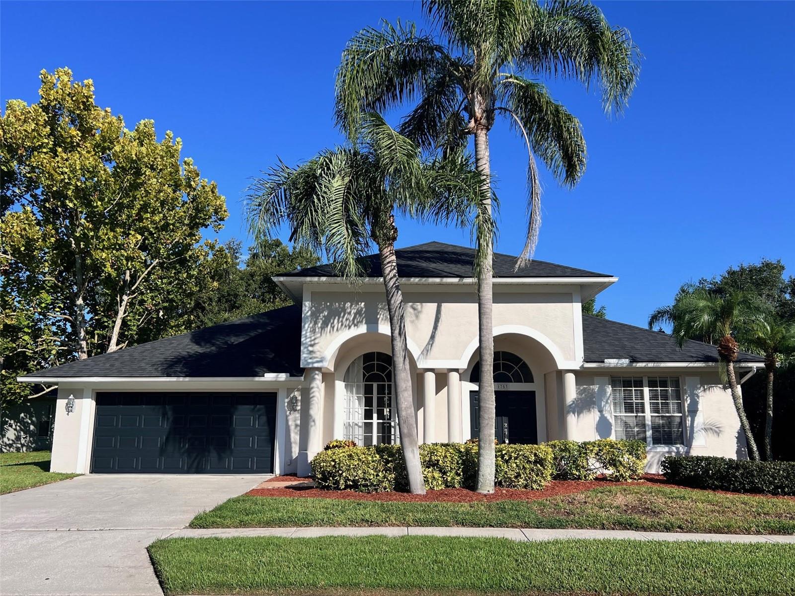 Welcome to this beautifully maintained 4 Bedroom, 3 Bath, 2 Car Garage Pool Home located in the sought-after Trinity Oaks community. From the moment you step inside, you are greeted with a spacious open layout featuring soaring high ceilings throughout, filling the home with natural light and creating a bright, airy, and welcoming atmosphere. The thoughtfully designed floor plan offers plenty of space for both relaxation and entertaining. The formal living and dining areas flow seamlessly into the large family room, while the kitchen opens to the living space, allowing for easy interaction and gatherings. The split-bedroom design provides privacy, with a generously sized primary suite that features its own access to the pool area, a walk-in closet, and a spa-like bath. Additional bedrooms are comfortably sized and ideal for family, guests, or a home office. Step outside to your private screened-in pool and lanai, where you can enjoy the Florida lifestyle year-round. Whether you are hosting summer barbecues, relaxing with a morning coffee, or taking a refreshing dip in the pool, this outdoor area is truly an extension of the living space. For added convenience, the rent includes both professional pool maintenance and ground maintenance, ensuring the home and yard stay in top condition while you simply enjoy your surroundings. Located in Trinity Oaks, this home offers the perfect combination of privacy and community, with easy access to top-rated schools, local parks, shopping, dining, golf courses, and major highways for a quick commute. This is more than just a rental — it’s a place you’ll be proud to call home.