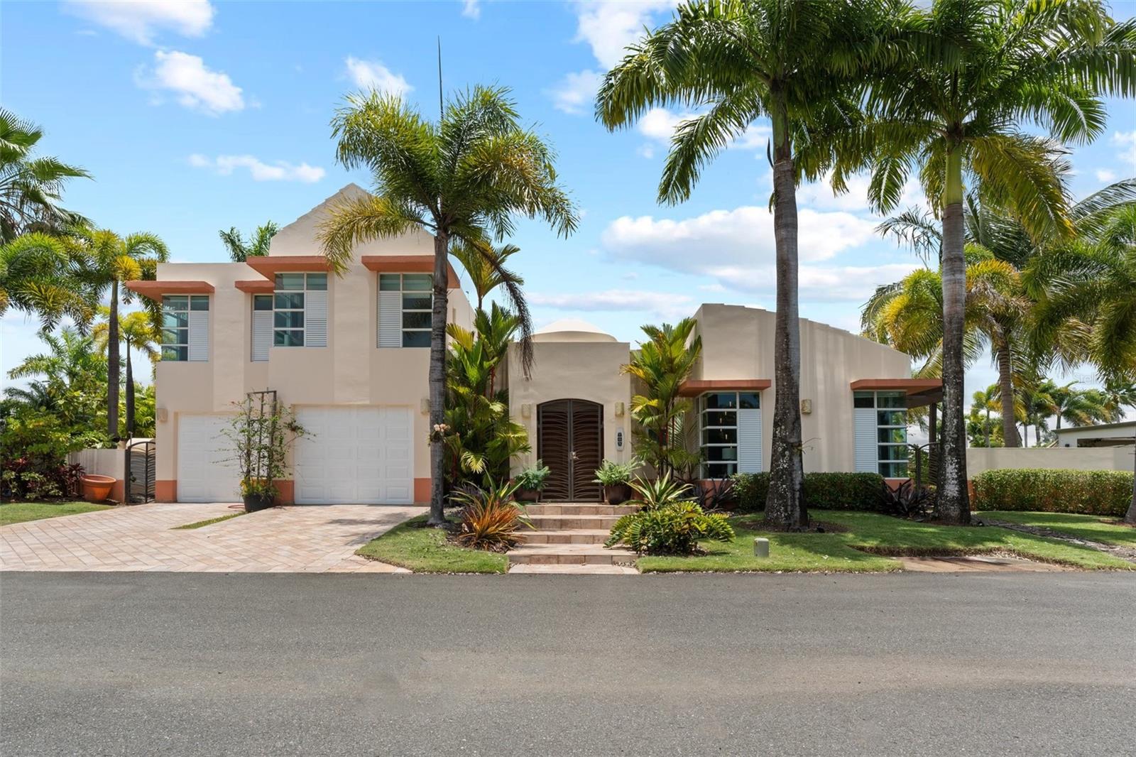 This inviting property in the gated community of Paseos Las Palmas offers a blend of comfort, space, and functionality in one of Dorado’s most desirable neighborhoods. With 5,026 interior square feet and 400 exterior square feet, there’s ample room to live, relax, and entertain.
The home features four comfortable bedrooms, each with its own walk-in closet, along with three full bathrooms and a guest half bath. A flexible room near the main living areas can easily serve as a home office, study, or den. The kitchen is spacious and functional, flowing into a naturally bright living area that brings a sense of openness and ease to the heart of the home.
Outdoors, the property is designed to enjoy. A covered terrace overlooks the pool and lounge area, creating a relaxed setting for gatherings or quiet moments. An outdoor bathroom and gazebo bar add convenience and character, making the space well-suited for entertaining. A two-car garage with extra storage completes the offering.
Blending comfort, utility, and a desirable location in Dorado, this property presents an ideal opportunity for those seeking a move-in-ready home in a private, community-oriented setting.