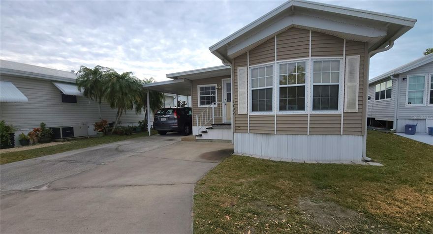 MAJOR PRICE IMPROVEMENT! SELLER NEEDS IT SOLD! TWO BEDROOM, 1 1/2 BATHROOM MOBILE HOME IN ACTIVE 55+ COMMUNITY. This 800 Square ft., furnished home is just waiting for you to make it your own. A/C replaced in 2022, Single Carport, Metal Roofover. Spacious living and dining rooms. Second bedroom has an en suite half bath. The laundry room is large enough for extra guest sleeping options.  SUGAR CREEK COUNTRY CLUB CO-OP HAS LOW HOA FEES of just $600 quarterly which includes water, trash, sewer, basic cable, internet, and grass mowing. There is an active social calendar with fun activities and outings during the winter months. Enjoy this community's proximity to the Braden River and River Links Golf Course. Sorry this is not a dog lot.