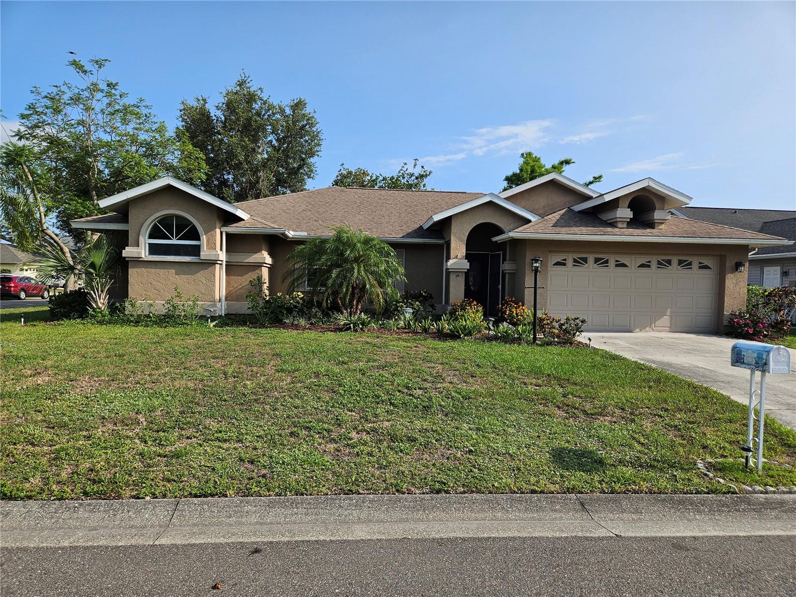 MAJOR PRICE REDUCTION!!! Fantastic family home situated on a large corner lot in Briarwood. The rear has a great view of a the lake from back patio. Very spacious with updated bathrooms and kitchen. Most rooms have luxury vinyl plank flooring. Living room and one bedroom have carpet. Kitchen and baths all have ceramic tile, as well as the Florida room. Low HOA fees. The wood burning fireplace adds a cozy touch to the family room and is great for those cooler winter nights. All stainless steel appliances in the kitchen as well as a custom epoxy countertop. Large window openings give lots of light to the interior. Some windows have been replaced with hurricane windows. Custom made sun shades across entire Florida room. Solar panels add to the efficiency of this home. (Solar panels are financed, and payments can be assumed with approval.) Mature landscaping. A/C only a few yeas old. The Briarwood community is a coveted location and very few homes are ever for sale here. Great community amenities include two inground pools with restrooms as well as two tennis courts. Maintenance contract can be assumed for the A/C unit. Home warranty available from the seller. LOW INTEREST FHA loan may be assumable with approval.
