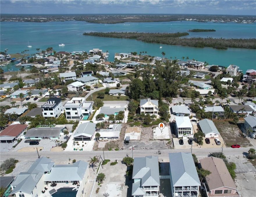 **A Canvas of Coastal Possibility Awaits**

Rarely does an opportunity of this caliber present itself — a pristine vacant parcel zoned for multifamily development, nestled within one of Southwest Florida's most coveted coastal corridors. This extraordinary landholding offers the discerning investor or visionary developer a blank slate upon which to craft something truly magnificent.

The allure begins with deeded beach access, an increasingly rare commodity along Florida's Gulf Coast that instantly elevates both desirability and long-term value. Imagine residents stepping from their doorsteps onto sun-kissed shorelines where turquoise waters meet powdery sand — a lifestyle that practically markets itself.

Speaking of marketing, the rental income potential here is nothing short of remarkable. Multifamily zoning unlocks the possibility of creating a boutique coastal residence generating substantial revenue streams year-round. Florida's insatiable demand for waterfront living ensures that thoughtfully designed units in this location would command premium rates from both seasonal visitors and permanent tenants alike.

The surrounding neighborhood exudes a relaxed yet refined coastal charm, where the pace of life slows to match the rhythm of the tides. Just moments away, Stump Pass Beach State Park sprawls across pristine barrier island landscapes, offering hiking trails, world-class shelling, and breathtaking sunsets that have become legendary among Gulf Coast enthusiasts. This proximity to protected natural beauty creates an irreplaceable amenity no developer could ever replicate.

Whether you envision elegant condominiums, stylish townhomes, or a luxury rental compound, this parcel stands ready to transform your boldest coastal dreams into profitable reality. Seize this moment before it drifts away with the tide.