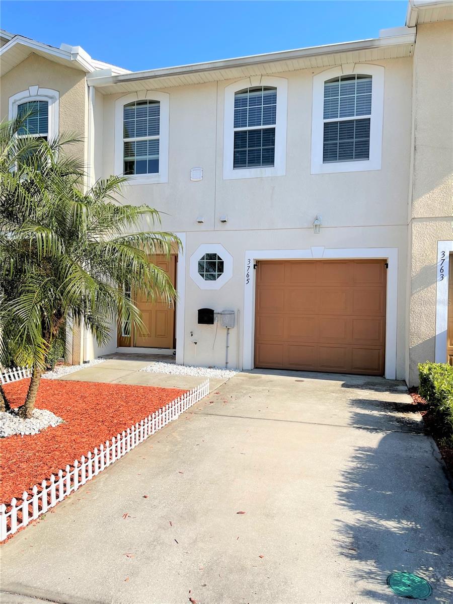 Beautiful 3 Bedroom, 2.5 Bathroom Townhome! Custom features include crown molding and millwork, stone accent walls, wood and iron staircase banister, and arched doorways. Spacious living room opens into both the kitchen and dining room. The kitchen has solid wood cabinetry, stainless steel appliances, a pantry & breakfast bar. The dining room has sliders with a view to a paver patio to enjoy the outdoors. The stunning staircase leads to a large living space upstairs and three bedrooms. The master suite has a stone accent wall, wood plank laminate flooring, a walk in closet and private bath. Community Pool with exclusive access only for residents. Location offers easy access to I-4, Tampa, the Attractions, Orlando, Lakeland downtown, Clearwater Beach, Plant City, Bartow and Winter Haven. Walkable distance (5 minutes) from Lakeland Square Mall. Only minutes to medical - shopping - restaurants!