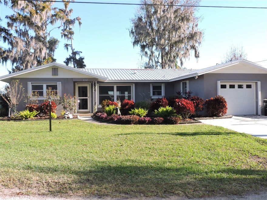 YOU CAN HAVE YOUR OWN LITTLE PIECE OF PARADISE WITH THIS WONDERFUL LAKEFRONT HOME ON LAKE PIERCE IN THE TIMBERLANE SUBDIVISON, A WILDLIFE SANCTUARY. THIS MUST-SEE, WELL-MAINTAINED, CB HOME HAS A METAL ROOF AND IS MOVE IN READY!! CALL TO PREVIEW THIS SPACIOUS HOME WITH FORMAL LIVING AND DINING COMBO, A VERY NICE KITCHEN WITH WOOD CABINETS AND GRANITE COUNTER TOPS AND APPLIANCES WITH A DINETTE AREA, FAMILY ROOM WITH GREAT LAKE VIEWS AND A SUB-ZERO REFRIGERATOR AND FREEZER WHICH IS GREAT FOR ENTERTAINING. THIS HOME HAS A NICE FEATURE OF THE MASTER OR PRIMARY BEDROOM AS A SUITE WITH BED AND A DEN AND BATH, INSIDE LAUNDRY AREA, SCREENED PORCH, STORAGE/WORKSHOP WITH WALL AC UNIT, DOUBLE BOAT DOCK, SEAWALL AND A LARGE CARPORT FOR BOATS AND EXTRA VEHICLES. ALL THIS PLUS A WHOLE HOUSE GENERATOR AND HURRICAN SHUTTERS FOR PROTECTION. THIS HOME  HAS IT ALL SO DON'T DELAY CALL TODAY.