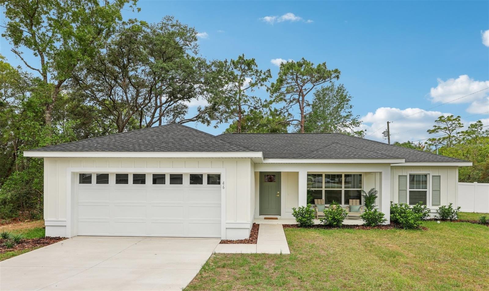 Under Construction. Fully Fenced! Seller is offering $5,000 towards buyer's closing costs! Welcome to your private sanctuary in beautiful Citrus Springs, Florida. This stunning new construction home is not just a house; it's a meticulously crafted retreat on a coveted corner lot in a wonderfully quiet part of town. This is where modern elegance meets comfortable living, offering a peaceful escape from the everyday hustle.
As you approach, you'll be greeted by an elegant, upgraded front door and stylish board and batten Hardie Board siding. A charming 119-square-foot front porch invites you to sit and relax, while the shutters on the right front window add a touch of classic curb appeal. Step inside and feel the easy-flowing, open-concept layout, where luxurious vinyl plank flooring stretches throughout the entire home.
The kitchen is the heart of the home, featuring sleek stainless steel appliances, a chic backsplash with wall tile, and brass plumbing finishes that add a hint of sophisticated warmth. Pendant lights over the island make it the perfect spot for casual meals or a morning coffee. The spacious master bedroom is your private retreat, complete with a tray ceiling and a spa-like en-suite bathroom boasting a beautifully tiled shower.
Every detail has been thoughtfully considered for your comfort. All three bedrooms are fitted with ceiling fans, and every window includes 2-inch blinds for instant privacy. Step out back to your private oasis—a 128-square-foot screened-in lanai with its own ceiling fan, offering a serene escape. Beyond that, a new 6-foot vinyl privacy fence encloses your backyard, giving you the perfect space for outdoor gatherings, gardening, or simply unwinding in complete seclusion.
This home combines superior craftsmanship with exceptional features, making it the perfect place to start your next chapter in a serene and welcoming community. Don't miss your chance and call us today! Photos are of same model, some colors and features of actual home may vary.