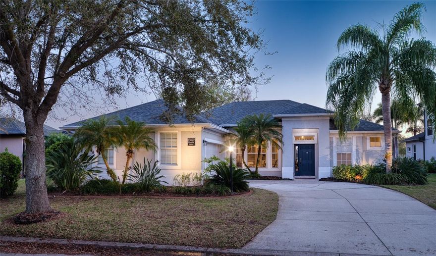 Enjoy the lovely water views from the rear of this beautifully appointed four-bedroom three-bath home, built by Homes by Towne. Out front, directly across the street, is a beautiful preserve view. Step into a spacious open floor plan featuring formal living and dining areas enhanced with elegant crown molding. The kitchen offers stylish upgrades, including quartz countertops, wood cabinetry, a pantry, stainless steel appliances, and crown molding on the cabinets.
The large family room, with built-in entertainment center, crown molding and rich luxury vinyl plank flooring, overlooks the pool and serene lake beyond. With four bedrooms and three full bathrooms, there’s plenty of room for family and guests. The primary suite is a true retreat, complete with: a sitting area overlooking the lanai, a walk-in closet, and a well-appointed bath featuring dual sinks, upgraded Corian countertops, a garden tub, and a linen closet.
Relax and entertain on the lanai, which includes a covered seating area, heated pool and spa, and tranquil water views. Additional highlights include surround sound, a side-load garage, upgraded tile in the primary bath, and convenient pull-out shelves in the kitchen—all of this in a fantastic Lakewood Ranch location. CAT-5 & RG-6 wiring throughout, 
Enjoy walking or biking to the community’s Adventure Park, offering dog parks, an inline skate rink, picnic areas, fields for soccer, baseball, and volleyball, plus a playground, and a Gardening Club. . This home truly shows beautifully!