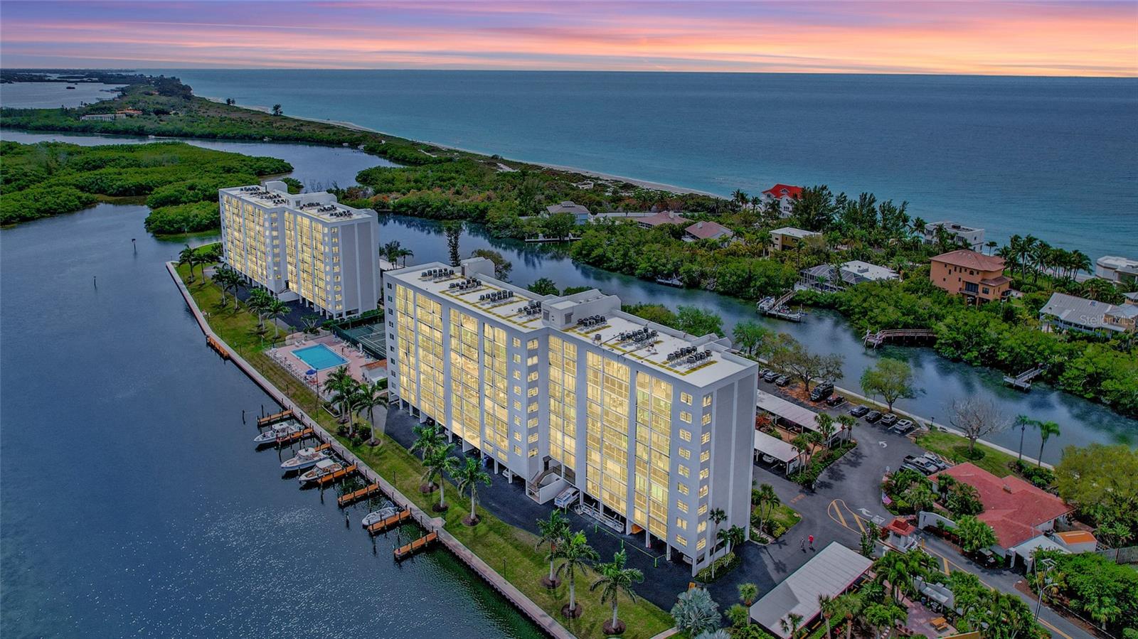 Private & gated Community on the Southern tip of Siesta Key with 180-degree water views! Sunrise and Sunsets both frame the 5.3 acres of manicured natural beauty!
This renovated 2 bed/2 bath condo offers the perfect blend of coastal comfort and modern convenience! This 5th floor unit boasts a well-designed layout, featuring a clear separation between bedrooms and family gathering spaces. This allows for privacy and relaxation while still promoting connection.
Step inside and be greeted by an abundance of natural light, accentuated by the seamless flow onto the expansive 29 ft. long glass/screen enclosed Lanai Terrace. The renovated kitchen and bathrooms feature solid wood cabinetry, granite countertops and stainless-steel appliances, creating a sleek and modern feel.
No more weekend chores! Ceramic and porcelain tiles throughout the living areas provide easy-to-maintain elegance, while the newer upgraded carpet in the bedrooms offers plush comfort. This condo is move-in ready and can be purchased furnished (with certain items excluded) for your ultimate convenience. Relax on the lanai and enjoy the balmy breezes thanks to the screened glass sliders, pocket-screened entrance storm door and custom window treatments.
Situated on the southern tip of Siesta Key, this iconic and historic community offers the best of both worlds. Witness breathtaking sunrises over the Sarasota Bay and Neville Bird Sanctuary and unforgettable sunsets over the Gulf of Mexico. Immerse yourself in the luxurious amenities including a heated lap pool & spa, tennis and pickleball courts, fitness room, sauna rooms, a community gathering center and much more! Kayak and canoe storage is available for a nominal annual fee, and boat slips can be rented for a monthly fee. Enjoy the private island with a fishing pier, gazebo, butterfly garden, and grills- perfect for outdoor picnics or entertaining.
This gated community provides security and peace of mind, with on-site property management and maintenance for your convenience. Dual elevators ensure easy access, and a dedicated walking path along the water allows you to enjoy the beautiful Florida surroundings.
Location – location – location! The Pointe is ideally situated close to the free public trolley (.3 mile) taking you directly to the world-famous Siesta Beach and vibrant Siesta Village. It’s also close to Turtle Beach (.4 mile) and several notable restaurants (.5 mile).
Don’t delay – your Paradise in Florida is waiting for you!