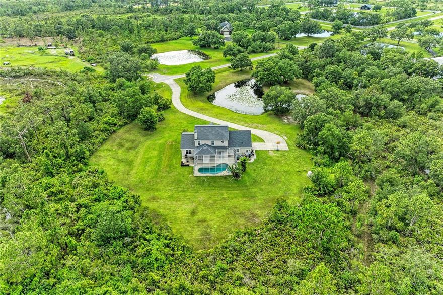 10 ACRES | NEWER ROOF | 5 BEDROOMS | OFFICE | POOL&SPA | UPSCALE CLOSE-TO-TOWN-LOCATION!!!!! | PRIVATE EQUESTRIAN TRAILS | NATURE & PRIVACY with no other houses in sight!  This PANTHER RIDGE Community in THE POINTE (only 28 ranches) sits 5 minutes behind LAKEWOODRANCH (#1 master planned community in the nation!) with UPSCALE SHOPPING, RESTAURANTS, COFFEE HOUSES, and BEACHES all within minutes!  BRING THE HORSES with miles of PRIVATE, WOODED & GROOMED TRAILS!  This Mark Cahill Built Home has 5 BEDROOMS, 3 FULL BATHS, FIRST FLR PRIMARY, FIRST FLR OFFICE, PLUS HUGE 2ND FLOOR BONUS ROOM!  Beautiful Stone Wood Burning Fireplace in Great Room with double French Doors to Covered Lanai with custom POOL/SPA PACKAGE!  Panther Ridge-The Pointe (named for its HIGH ELEVATION AT 100FT) with its Impressive Entry Way RELAXED LIFESTYLE, will give you the best of both worlds -- PRIVACY & CLOSEBY UPSCALE AMENITIES.  ---New Roof 05/28/2021 **