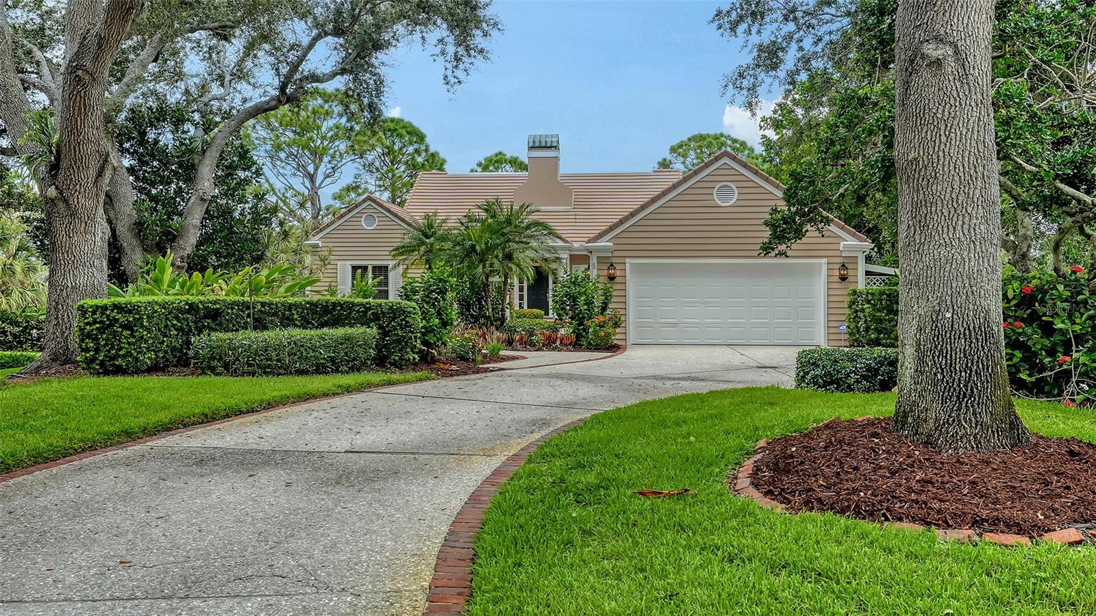 This stunning 3 bedroom, 3.5 bath home, designed by the renowned architect Frank Folsom Smith, stands out with its unique design. The charming Cape Cod style sets the stage for comfortable, graceful living. The home, with beautiful wood floor throughout the main living areas, features a Sonos stereo sound system. The backyard, overlooking the preserve, and offering a lovely sunset exposure, is a quiet sanctuary, where you can enjoy the open air, freeform pool with spa in complete privacy. The whole-house stereo system goes out to the screened back patio, making a lovely place to sit and enjoy a peaceful afternoons and twilight dinners. There is an additional 732 square feet of outdoor deck space off the second floor and rooftop. Recent renovations in 2023 include two main bathrooms with high-end decorator tiles, premium glass enclosures, and premium plumbing fixtures, including an elegant standalone bathtub. The powder room has also been completely renovated. Living room area has a wine cooler and wet bar and spacious dining room area The kitchen boasts new ceramic tile floors, backsplashes, an induction cooktop, an LG smart refrigerator, a farmhouse sink. The laundry room features new ceramic tile floors, newer washer and dryer, extensive shiplap walls, and a sliding hanging barn door to the pantry. The second-floor bathroom has new tub fixtures, shiplap walls, and a decorator granite sink area. Additional features include crown moldings throughout the ground floor, new ceiling fans in all bedrooms and the den/office, with a decorator oversized 52-inch windmill fan in the main bedroom. The home also has new LED ceiling can lights, new plantation shutters in the front hall/foyer, and new Zebra shade blinds in the kitchen and laundry room. The pool area has been upgraded with a new heat pump pool heater, a new filtration system, and a new pool pump and motor. The lanai has new aluminum framing and screening with a screen door, installed in 2025. The second floor has a new flat roof by Curry Roofing with a warranty. The landscape has been renewed with new trees, bushes, sod, and flower plantings worth $20,000, completed in 2022. Premium decorator light fixtures have been added to the dining room, kitchen, and foyer. The entire house exterior was painted in August 2025, and a new second-floor deck was also completed in August 2025. The pristine condition of the lovely home, combined with the quiet, private setting on double lot at the end of a cul-de-sac, makes it the perfect Florida retreat for you and your loved ones. Situated in the enclave of Bishopscourt, a maintenance-free neighborhood behind the gates of The Oaks Preserve, lawn and landscape maintenance, as well as irrigation, are included in the homeowner’s association fees. You will delight in this graceful, inviting home. Membership in The Oaks, Sarasota’s finest golf and country club, is required with homeownership. With two distinctly unique 18-hole championship golf courses, 12 HAR-TRU tennis courts (4 lighted), croquet and pickle ball courts, a state-of-the art fitness center, fine and casual dining options, and a wealth of social events, The Oaks is truly Sarasota’s premier golf and country club.