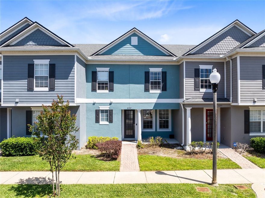 Welcome to Lee Vista Square, where style, comfort, and convenience come together in this well maintained courtyard style townhome with charming curb appeal, a covered front entry, and a rear entry detached two car garage. Inside, the first floor feels bright and inviting with high ceilings, oversized tile flooring, and a layout that gives each space its own purpose while still feeling open and connected. The front living room welcomes you with natural light and a stylish accent wall, then flows into a spacious dining area and updated kitchen at the rear of the home. The kitchen features white cabinetry, stone counters, stainless steel appliances, a modern backsplash, pantry storage, and a large island with seating that anchors the space beautifully. A first floor half bath adds everyday convenience, while the private paver courtyard offers a spacious outdoor retreat for relaxing, entertaining, and enjoying low maintenance outdoor living. Upstairs, all three bedrooms are thoughtfully arranged on the second level, including a spacious primary suite with tray ceiling, laminate wood flooring, great natural light, a walk in closet, and an updated en suite bath with a glass enclosed walk in shower and custom tile detail. The additional bedrooms offer flexibility for guests, family, or a home office. Residents enjoy access to the community pool and playground, all in a centrally located Orlando location with easy access to 528, 417, 408, Lake Nona, Medical City, and Orlando International Airport.