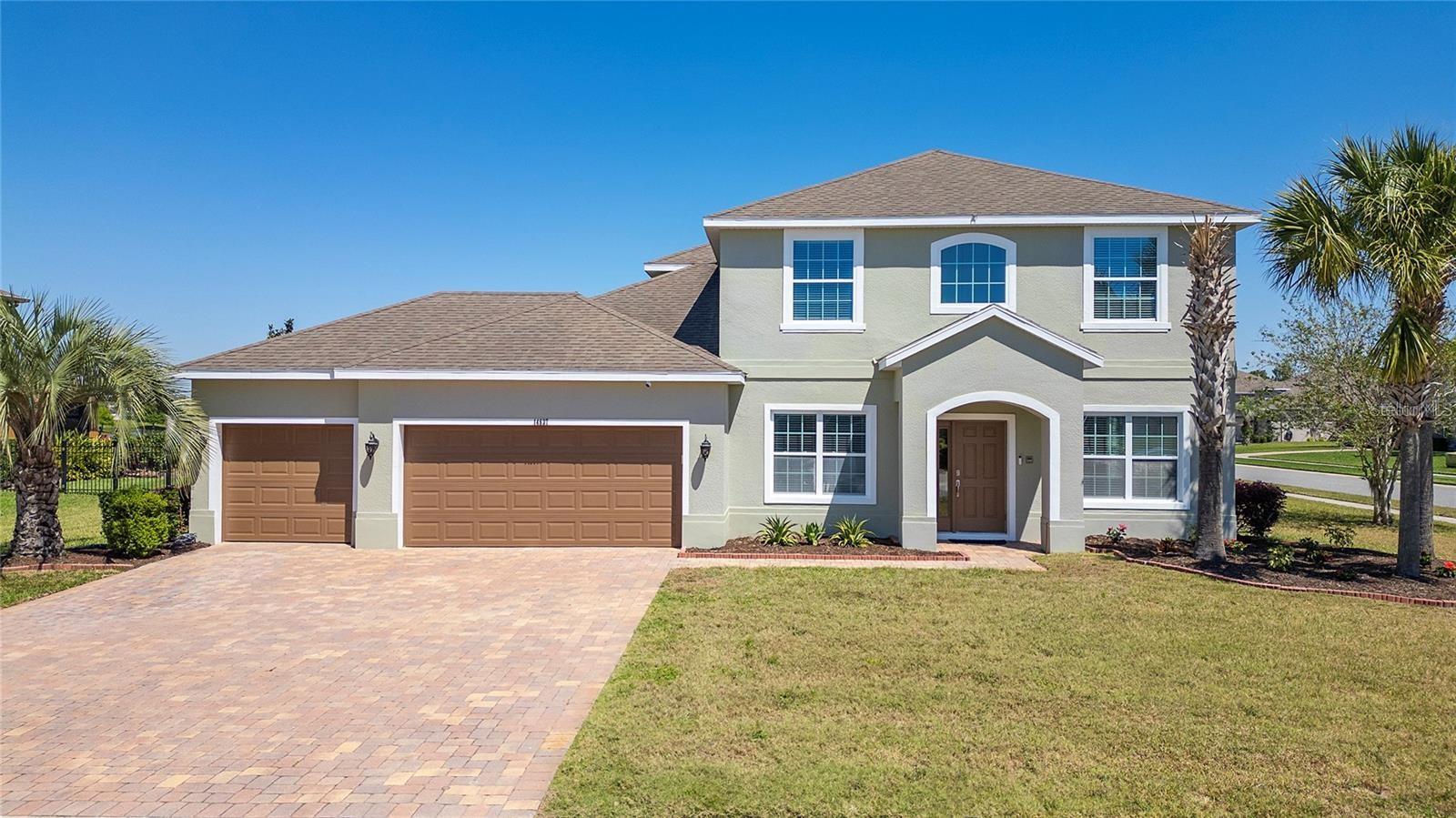 RENT-TO OWN option available to qualified tenants. This stunning two-story, 5-bedroom, 3.5-bath, 3,300 sqft residence is nestled on a spacious half-acre lot, offering unparalleled comfort and luxury for any size family. Inside, a modern open floorplan seamlessly connects the kitchen to the family room, creating the perfect space for gatherings. TWO MASTER bedrooms one downstairs and one upstairs provide flexibility and convenience for multi-generational living or hosting guests. Additionally, a loft area near the upstairs master bedroom offers extra space for a second living area or a game area. Step outside to relax on the covered patio with ceiling fans, enjoying the expansive yard and serene pond view. The home boasts tile and laminate flooring throughout, a separate breakfast area and formal dining room, a 3-car garage, and a dedicated laundry room. Conveniently located near UCF, top-rated schools, Publix, and Waterford Lakes Town Center which offers plenty of restaurants and entertainment this home is perfect for professionals and families alike. Don't miss out on the opportunity to make this stunning rental property your new home sweet home! Schedule a showing today and experience luxury living at its finest.