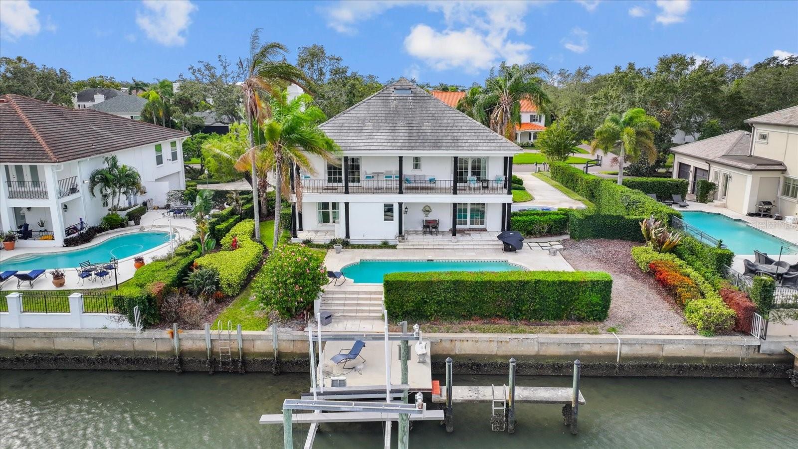 Available for Lease, take a look at this beautiful waterfront pool home in the highly sought-after gated community of Culbreath Isles. Fully furnished, even the coffee maker is included. Short-term rental is also available for a higher rent rate. This home is located in an A-rated school district, close to bridges, airports, dining, and shopping. This is a tropical paradise perfect for entertaining guests. The backyard features a concrete seawall and dock with a boat lift, travertine pool deck, covered patio, salt water pool/spa, and it is situated on the Grand Canal with access to the Bay. Just bring your kayak, boat, or yacht !! This home features a grand elevated front entrance, dual spiral staircase, side entry double bay garage, and a multi-column front porch. The second floor features a spectacular kitchen, family room, dining room, living room, and master suite. The private balcony offers stunning views of the deep Grand Canal. The kitchen living room combo features travertine flooring throughout, solid wood cabinetry, granite counter tops, stainless appliances including a Subzero fridge, a built-in wine fridge, an island seating that opens to the living room stone fireplace. Washer and dryer included. Newer impact double pane Pella hurricane windows, patio sliders, and doors. Step downstairs to the remaining bedrooms, which can double as a home office, gym, flex space, or nursery. Brick flooring throughout common areas leads to the living room featuring a wet bar. All this and just minutes to Tampa's top public and private schools, world-class shopping, sports arenas for our Super Bowl Champions and Stanley Cup Winners, Florida's top-rated beaches, and only minutes to Tampa International Airport.