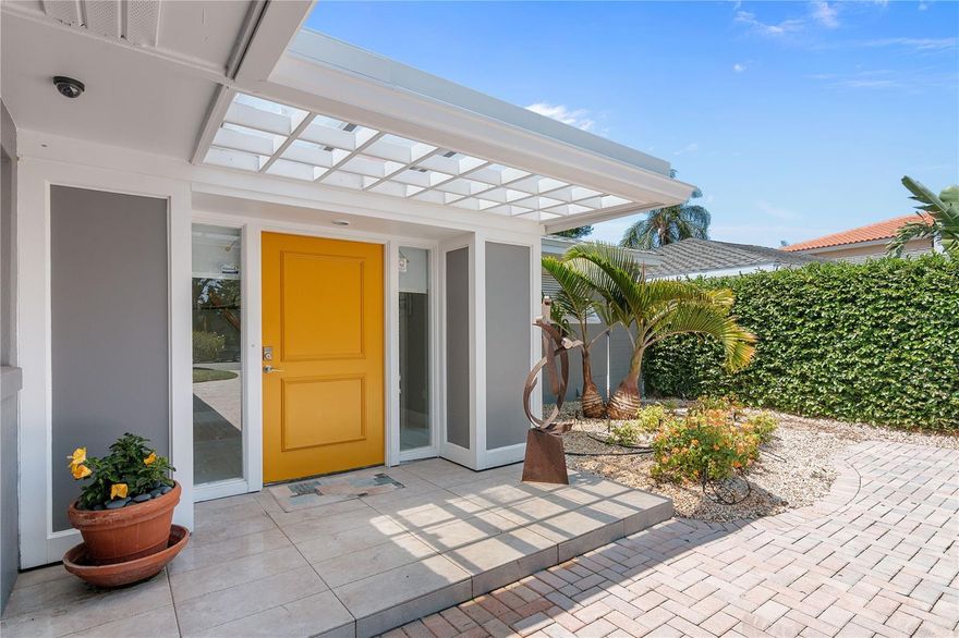 Expansive big water views of Pansy Bayou from almost every corner of this immaculately maintained recently renovated mid century beauty. Situated on a protected manatee refuge where only 30 lucky property owners are permitted easy access by boat or kayak to the bay. Steps to St. Armand's  Circle and Lido Beach. This home exudes quiet sophistication with an open floor plan, and three bedrooms each with walk in closets and  en suite bathrooms.  newly renovated chef's  kitchen with all newer top of line appliances. The master bedroom has great water views with an attached 2 desk home office.  There is a laundry room right off the kitchen and an oversized 2 car garage.  The screened patio, lanai area overlooks the private dock and boat lift and is surrounded by lush mature landscaping which includes a spectacular banyan tree providing serenity and shade.  This charming  historic neighborhood is one of the most coveted spots in Sarasota.