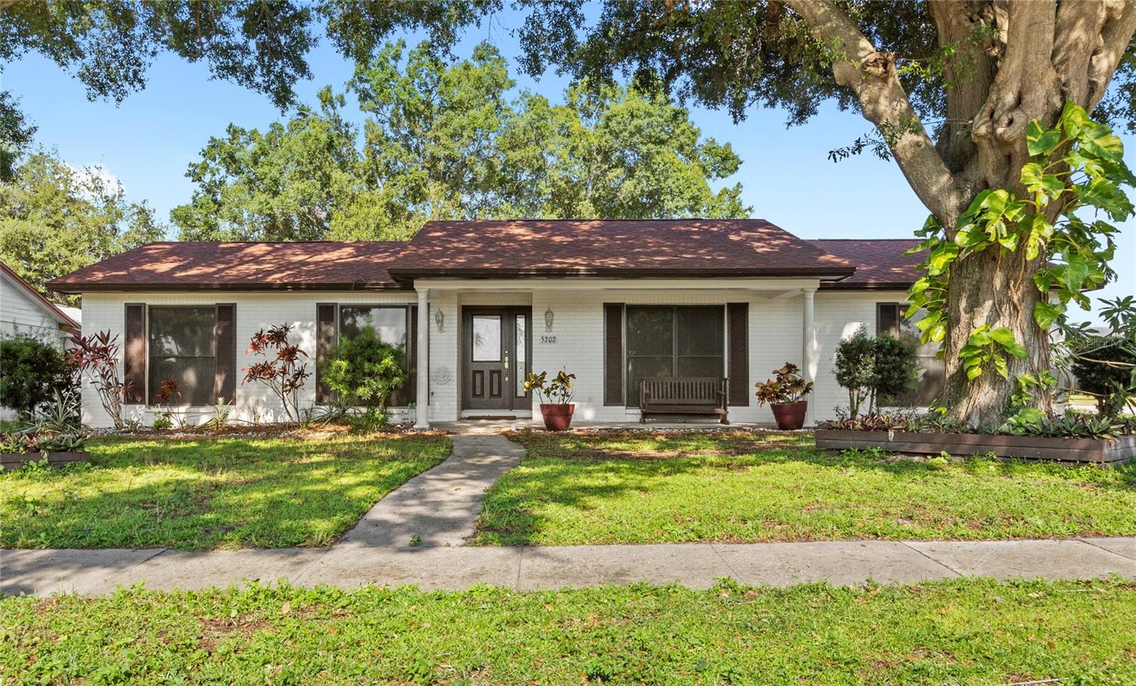 One or more photo(s) has been virtually staged. No HOA, located in the esteemed Dr. Phillips community - just 5 minutes to Universal Studios & Dr. Phillips High School, 10 minutes to Restaurant Row, 15 minutes to Walt Disney World Resort & Universal's Epic Universe, and 20 minutes to Downtown Orlando & the Orlando International Airport! Nestled in the highly desired Lake Cane Estates, this charming 4 bedroom, 3 bathroom home sits on an oversized corner lot, shaded by cascading oak trees, providing ample privacy and comfort. This home features a traditional floor plan, offering both a formal living room and dining room along with a breakfast nook, family room with a fireplace, and a Florida room for indoor-outdoor living. The split floor plan separates the guest bedrooms from the primary suite, ensuring ultimate privacy for residents and guests alike. A 2003 addition saw the family room, the fourth bedroom, a full bathroom, and the Florida room added to the original floor plan of the home, expanding the footprint substantially. The unique side-loading 2-car garage features ample storage space, cabinetry, and workbenches, making it highly functional while preserving the curb appeal from the front of the home. A newer roof (2022), a full re-piping of the home (2021), new carpet (2025), and fresh interior paint (2025) kick off the list of recent improvements, offering a solid foundation for the next owner to make this home their own. After being meticulously maintained and lovingly cared for by the same owners for 30+ years, this home is ready for its next chapter. Contact us to schedule your private viewing today!