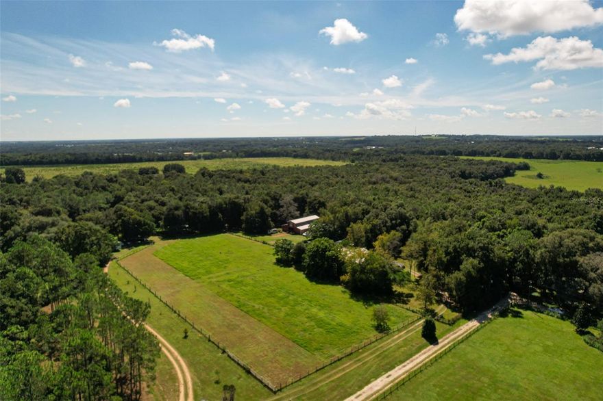 FELLOW REALTORS BRING A BUYER**
Rare opportunity to purchase a 30-acre, working farm located just 6.7 miles from interstate 75 and minutes from downtown Dade City.
The property features a small family block home, 2 barns - 1 oversized fully enclosed metal barn with water, electric, and a 2nd floor deck overlooking a wooded area, the 2nd one is a large pole barn.
Plenty of room for all possibilities including development.