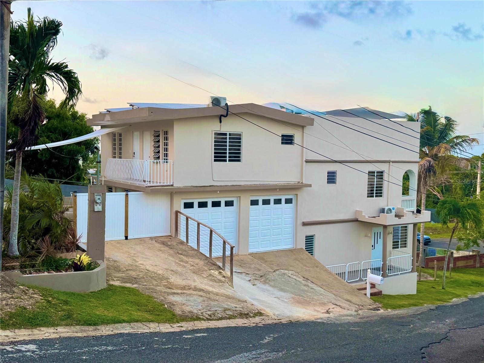 Just 5 minutes from Pastillo Beach and close to Villa Pesquera and the scenic Paseo Lineal trail, this unique 3-level home offers flexibility, character, and location all in one. The layout can function as a personal retreat, short-term rental, or even be converted into multiple units. The second floor features a private master suite with its own living room and kitchenette, while the third level includes two additional bedrooms with ensuite baths and a rooftop terrace with a half bath and bonus room—ideal for an office, studio, or guest area. The main floor offers a newly renovated kitchen, open living and dining areas, and an extra flex room. Additional highlights include 4.5 bathrooms, a brand-new 10x20 pool surrounded by coraline stone, solar panels, a new septic system, and space allocated for a future wine cellar. Previously used as three separate units, this property gives you the freedom to shape it to your lifestyle or income goals.